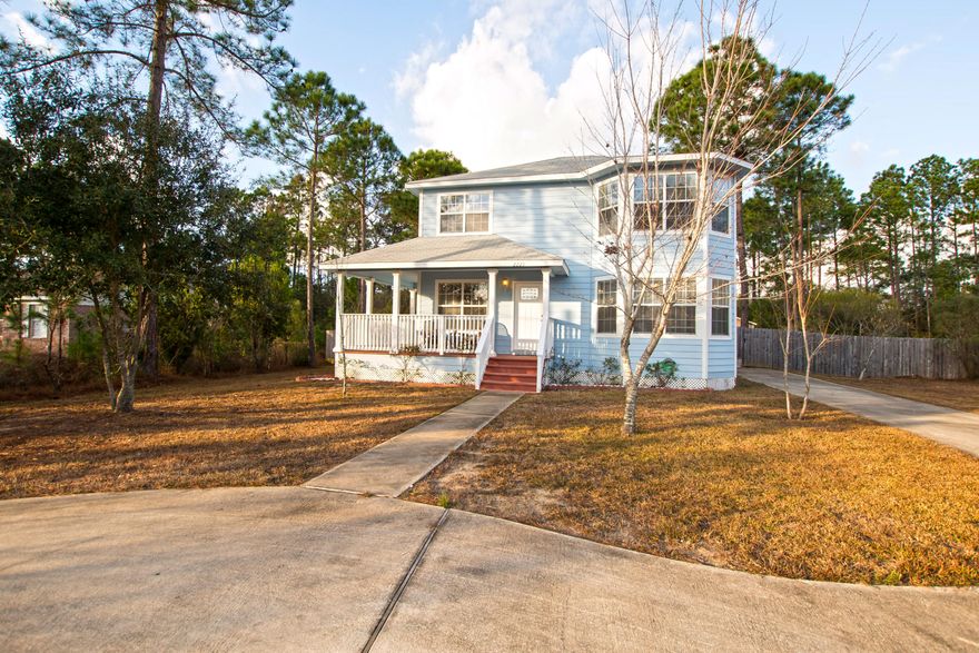 This home has so much charm and curb appeal that you will fall in love before you even open the front door. This victorian style exterior is so inviting with a wrap around front porch and semicircular drive with the bonus of so much parking. From the moment you step inside with the warm wood flooring and fireplace you are sure to feel invited. This 3bed 2.5 bath home has just as much charm in the back as it does the front! The screened in porch is a wonderful place to hang out and enjoy the expansive back yard. Need another outdoor space, look no further there is a pergola and fire pit as well. You will really be able to entertain from this home. Located walking distance from the primary and middle school makes this a great home for families. Make an appointment to see it today.
