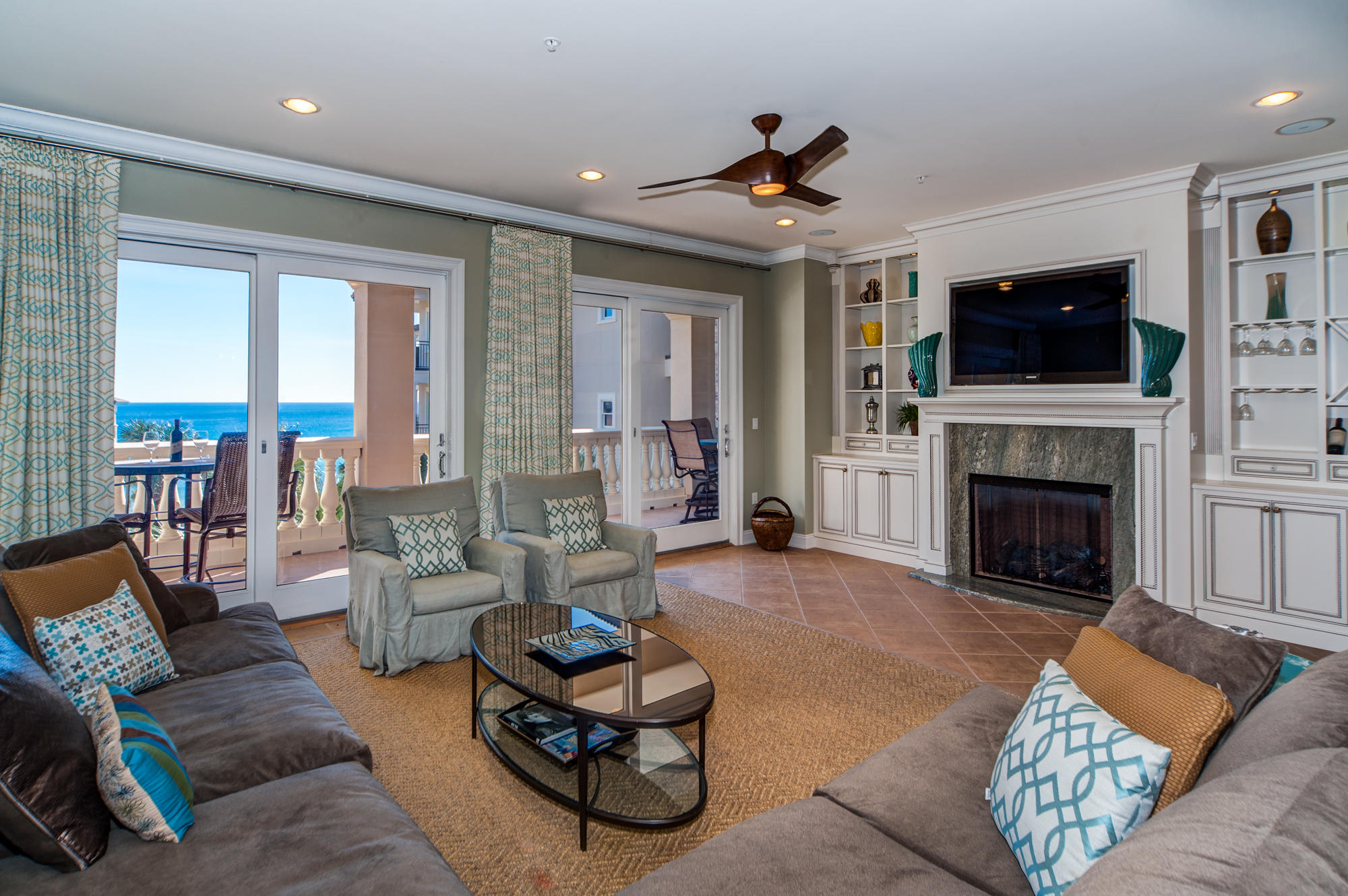 Coastal elegance awaits you! Rising above the highest point on the U.S. Gulf Rim gracious living abounds with views of the piazza and Gulf of Mexico in this luxurious 3rd floor residence, B301, in beautiful gated Bella Vita at Blue Mountain Beach. Discover a gem within Bella Vita overlooking the sparkling fountain as the piazza view unfolds to the gulf. The owners are offering this premier condominium furnished. The well conceived design is all about family, entertaining and effortless beach living. This floor plan is a favorite for it's graciously sized rooms and end location, flooding the master bedroom and corner guest room in sunlight. The Seller added a beautiful granite surround fireplace and built-ins in the spacious living room. The home's open floor plan is flooded with light