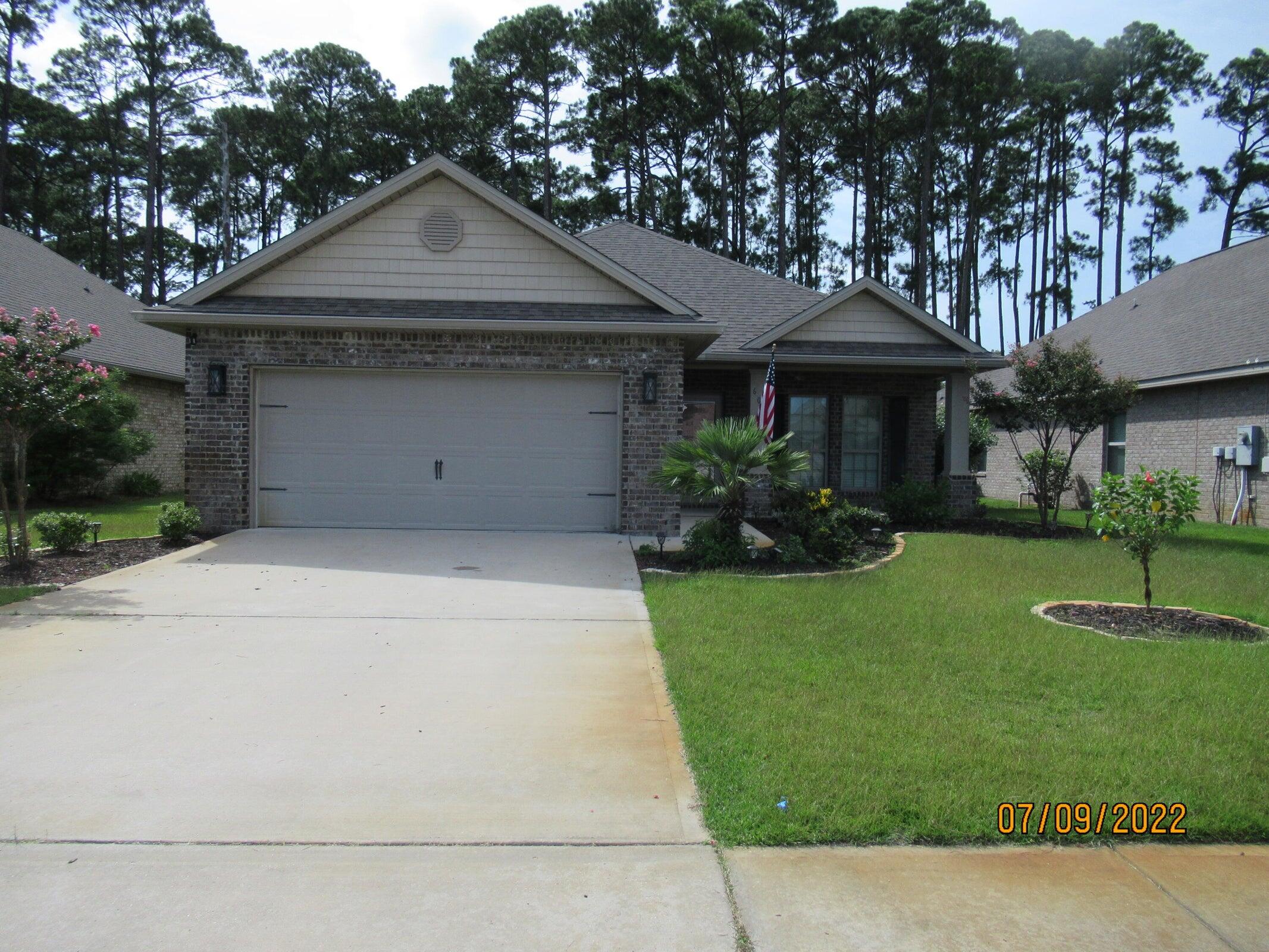 Beautiful 4 Bedroom/2 Bathroom brick home in the sought after DRIFTWOOD ESTATES just off Mack Bayou! It features open floor plan, gorgeous hardwood flooring, trey ceilings, crown molding and arched entrances. Screened in porch fire pit in the yard. Washer/dryer included. Solar panels on both sides of the home make it very energy efficient for your utilities. There is a $2,700 deposit. Small pet allowed with a pet fee.