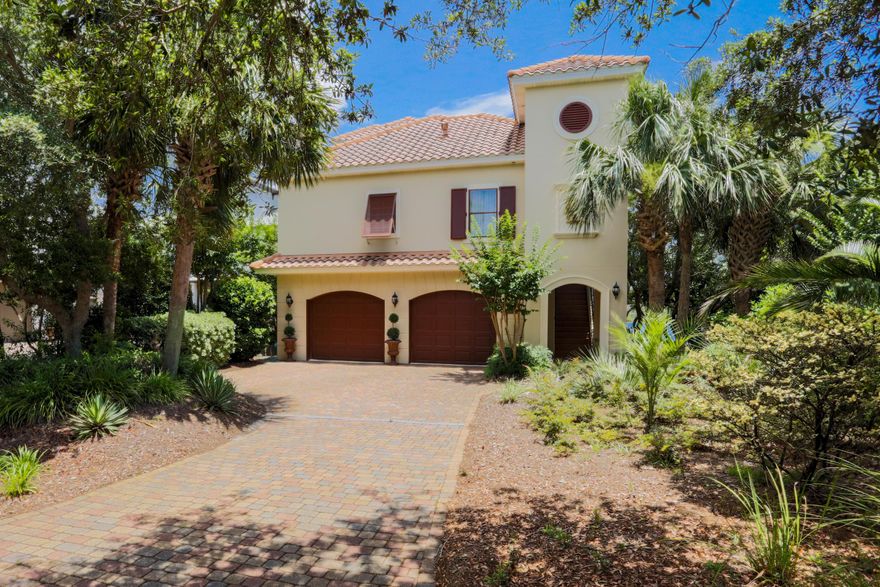 This elegant 3-story lakefront home on a quiet cul-de-sac in the gated community of Destiny West offers fabulous vistas over Lake Destiny and the Gulf of Mexico and a relaxing but active lifestyle in one of Destin's favorite communities! The home's orientation and floorplan allows for enjoyment of the lake and views from all 3 levels, as well as a gathering space on each floor. The primary entrance is on the second level: the foyer features beautiful bamboo floors, archways with dramatic columns, and rich crown molding around the tray ceiling. The living room features large windows, access to the open patio overlooking the lake, a glamorous tray ceiling with chandelier, and a beautiful two-sided fireplacethe other side of which faces the dining room, which also enjoys great view