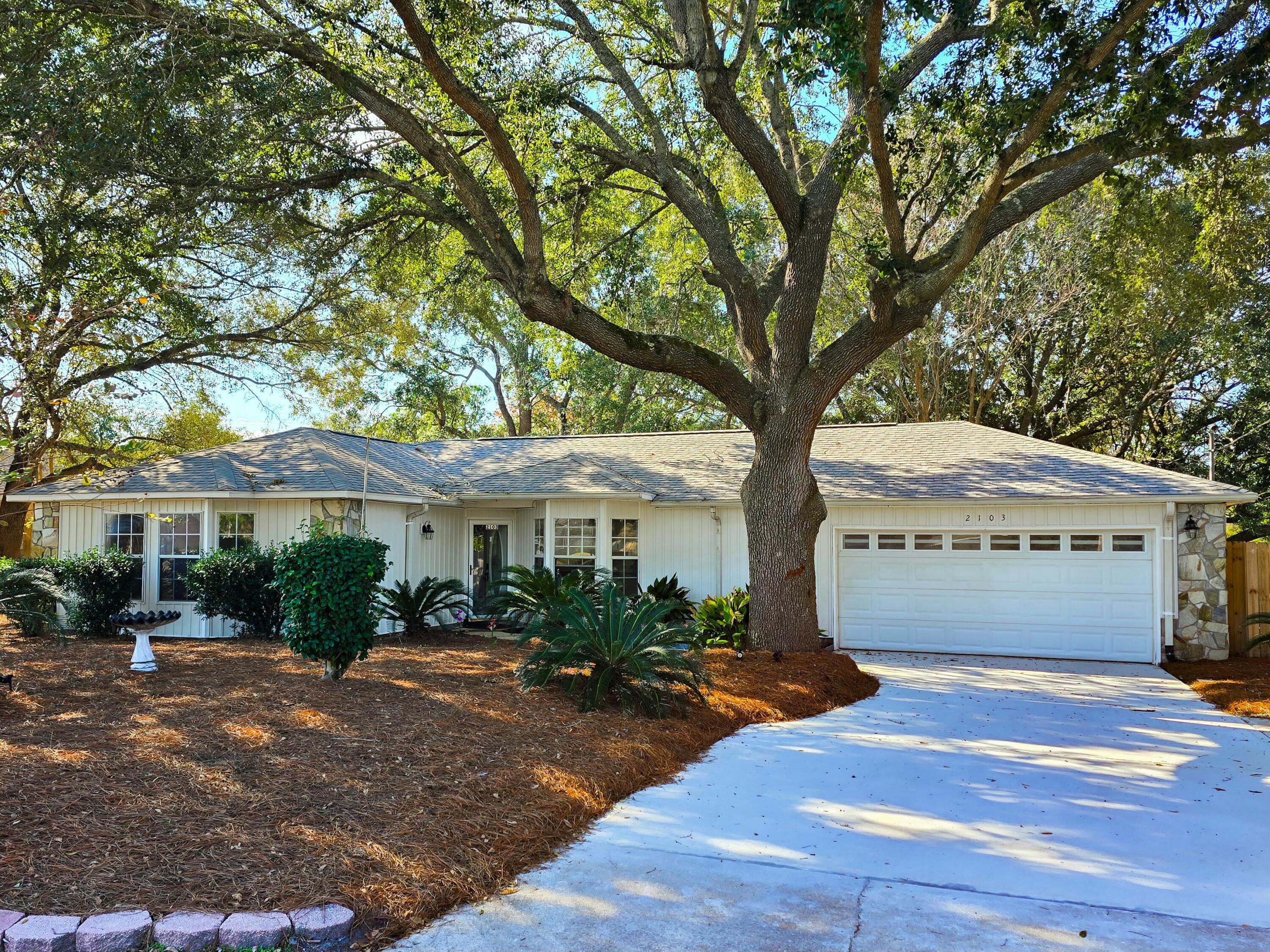 One of the lowest priced homes in Holley by the Sea! Recently upgraded with over $30k in renovations, this exceptional 3bd/2ba home has all new driveway, paint, lvp flooring, front siding, faucets, toilets, hardware, modern light fixtures, and much more. Featuring an open living concept with vaulted ceiling plus a dining space that flows out to the spacious enclosed patio, you're going to love this floor plan. The primary bedroom has not one but two walk-in closets for plenty of storage. At almost half an acre, the large lot is adorned with majestic, mature trees, which provide shade and help keep cooling costs reasonable. Additionally, the septic pump was replaced, a new water heater recently installed, and a 4-point inspection completed, which provides peace of mind. The seller is also willing to offer a home warranty. Location is paramount and this Navarre gem offers easy access to so much. It's only a 10-minute drive to the emerald waters of Navarre Beach. Everyday essentials, from shopping to dining to medical, are also conveniently close at hand within only a few miles. The esteemed Holley by the Sea community itself presents an array of unmatched amenities, including a multi-million dollar recreation center, multiple pools, an expansive gym, game room, classes, pickleball, sports fields, playgrounds, and boat launch on the bay - encouraging a lifestyle of enjoyment and recreation. Embrace the opportunity to make this your dream home in this highly sought-after community. Schedule your showing today!