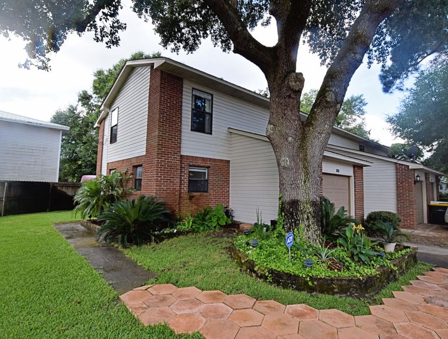 Welcome Home! This 2bed/2.5bath townhome in Fort Walton Beach is conveniently located near Miracle Strip, Brooks Bridge, and the sugar white beaches of Okaloosa Island .between Updates in the past five years to include the Central A/C unit inside and out, hot water heater, dish washer, refrigerator, ceramic top stove/oven and garbage disposal. This unit includes lovely landscaping and beautiful side yard with sprinkler system and additional parking for 4 vehicles. The kitchen, half bath and living area can be found on the downstairs level with tile flooring throughout.