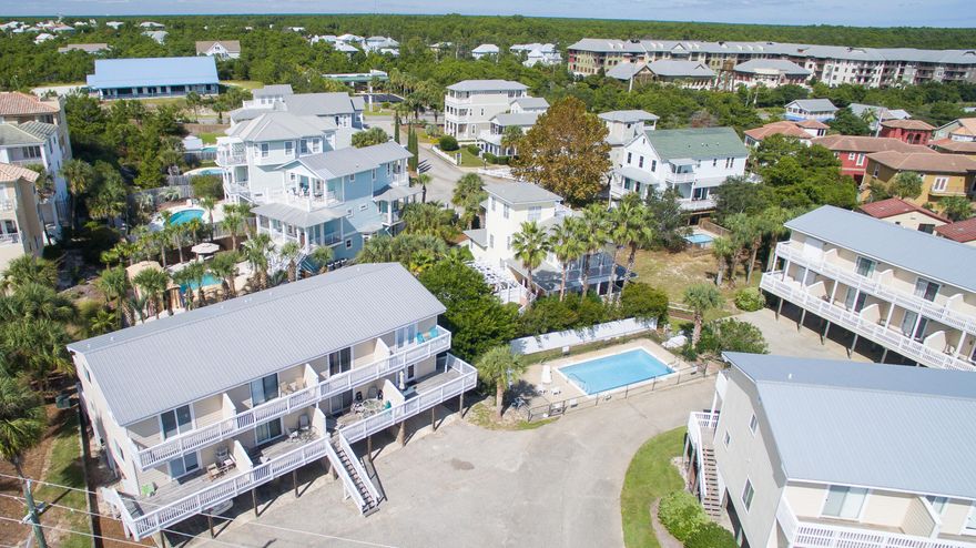 Gulf-views and convenience to the beach bolster this rare offering in Blue Mountain Beach. The charm of this 2 bedroom, 1.5 bath town house is evident with sprawling porches coupled with gulf views. The great room provides open living fit for you and your guests. The third level houses both bedrooms to optimize views with decks off each room. Community pool, ample parking, and storage room for beach toys complete your new beach home south of 30A.