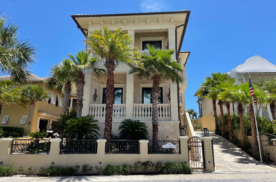Beautiful landscaping, incredible views and the finest building materials create this spectacular beach home on a 50 foot Gulf of Mexico lot in the gated beachfront community of Carillon Beach.  The construction of the home is solid concrete with finishes, inside and out, of beautiful solid natural stone, onyx and granite. The elegant white Italian marble fountain and greenery welcome you to the home's entrance. The three-story main house has an inviting covered entry on the first floor and on the inside, a half bath, elevator, and stunning circular stairway adorned with hand wrought metalwork draw you in. The oversize garage, golf cart garage, bicycle storage, outdoor furniture storage, and supply storage room are all a part of the first floor.  The garage and all storage areas are all conditioned space. There are approved DEP plans to add two additional bedrooms on the first floor, if desired. The second floor consists of a  guest bedroom and bath, covered outdoor grilling area,  kitchen with bar area, oversized island with seating, Wolf gas 4-burner range with grill, SubZero refrigerator/freezer, icemaker, and two sinks. The dining area, adjacent to the kitchen has a large table. The living room completes the open plan concept with fireplace and full Gulf of Mexico views that open out to a massive covered porch with gas and glass fireplace. Continuing up the spiral staircase to the third floor is an open study area with private outdoor porch and two en suite guest bedrooms. There is a nicely located and large laundry room with 4 cleaning/drying units and closets for hanging/drying clothes.  For convenience, it opens to the custom master closet. The master suite encompasses the entire width of the upper floor, overlooking the glorious Gulf views from Panama City Beach to Destin. A large shower unit and free standing solid copper footed bath along with large double sink and storage area complete the master bathroom. This area also has a lovely private, outdoor covered porch.

The guest house is accessible from the ground floor or from the overhead walkway on the second floor that leads from the main house to the guest quarters. The first floor of the guest house has a guest bedroom, a bunk area, and two full baths. Upstairs is a large open plan great room with full bath and kitchen with Subzero refrigerator/freezer, Kitchenaide microwave and two burner gas cooktop. A well planned island with seating completes this space.

Step out onto the private beach walkover and you're on the beach. Community pool and Lake Carillon are across the street. This is a dream home!