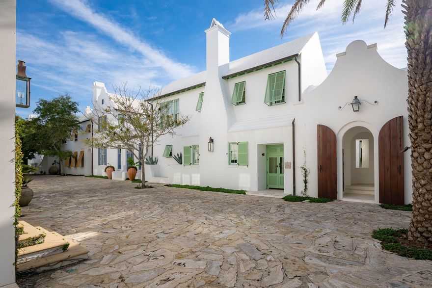 The Sea awaits with the offering of 23 Governors Court situated on the iconic Sea Garden Walk pedestrian path leading to the Gulf of Mexico.  ''Santigua'' as this home was formerly known was Alys Beach's original statement home.  Architect Gary Justiss created this masterful design embodying the original Alys Beach palette inscribed by the Bermudan & Antigua, Guatemalan architecture.Entering the courtyard lends itself to utter serenity accented by the grotto swimming pool and lone palm tree standing above the vibrant landscape.  Outdoor privacy integrates with indoor connecting the spaces by way of covered loggias for afternoon cocktails poolside.  The first floor encapsulates one's living needs having interconnected kitchen, dining, and living rooms boasting custom