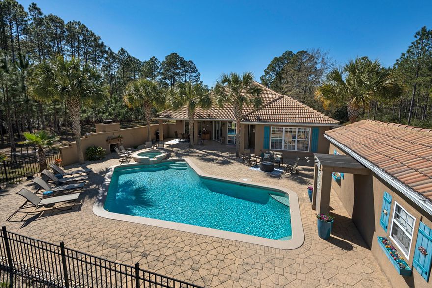 You won't find this many extras in this price range anywhere else in Santa Rosa Beach! Don't miss this gorgeous Mediterranean style home, complete with a lushly landscaped pool and hot tub, overlooking beautiful Lake Alicia. This home maximizes every inch of square footage, boasting an open floor plan that is perfect for entertaining with pool and lake views from almost every room! With three large bedrooms plus an office, a large foyer and multiple sitting areas, you really have room to stretch out in this stunning home. Crown molding throughout the entire house, gas fireplace, granite counters, custom closets, built ins and stainless steel appliances are just a few of the interior upgrades. The oversize lot and side driveway can house a boat, an RV and multiple cars with NO HOA to