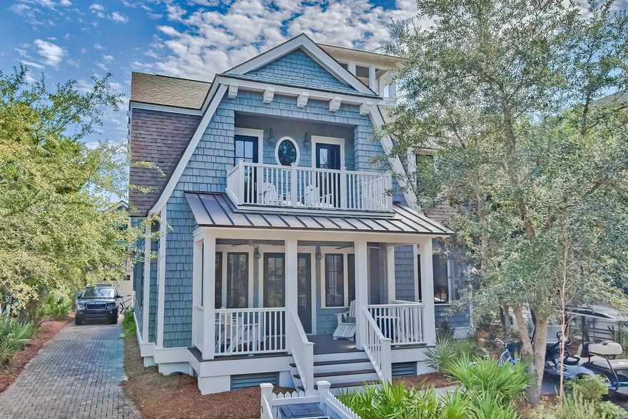 Located behind the private gates of Watersound Beach, this picturesque residence boasts over 3,700 square feet of thoughtfully designed living space bordered by lush vegetation and covetable Gulf views. A true icon of craftsmanship executed by the sought after architect T.S. Adams and renowned building team at Monte Hewett Homes. Upon entering the front door you are greeted by the charming living room adorned with wood plank ceilings and hand scraped Nordic white pine flooring. The Chef's kitchen features custom cabinetry, an oversized island, and top of the line appliances. Step outside and enter a world of your own: multiple outdoor living areas synonymous with relaxation include a screened-in porch, sun bathing deck, outdoor fireplace, and gunite pool.