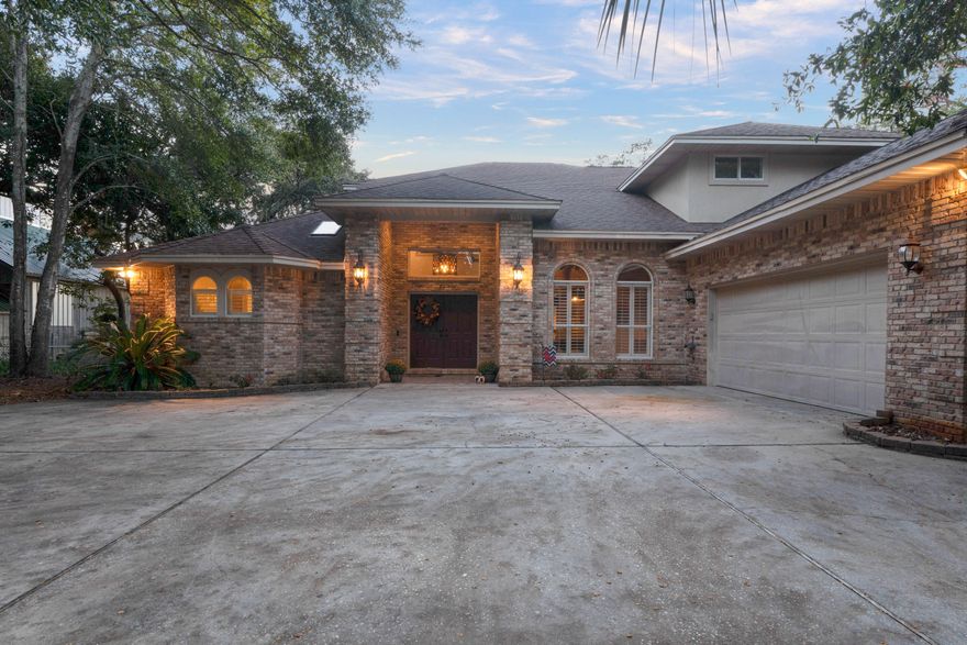 Absolutley the most desired location in Destin. The beautiful brick home is located on Marler Bayou, the closest bayou to the Destin Pass. One of it's unique features is that it has your very own boat ramp!!! The home has been updated throughout to inlcude Viking gas stove, granite countertops and custom wood wet bar with a kegerator. The large living room area with 19ft. ceiling and a custom wood wall that is breathtaking! There are a lot of features in this home that are custom to include some light fixtures made out of 100 year old antique wood and Cypress shelves in living area. Beautiful screened in porch that over looks the Bayou. Large master bedroom room with vaulted ceilings and a walk in closet. The home is situated on a large lot with big oak trees and Magnolia trees