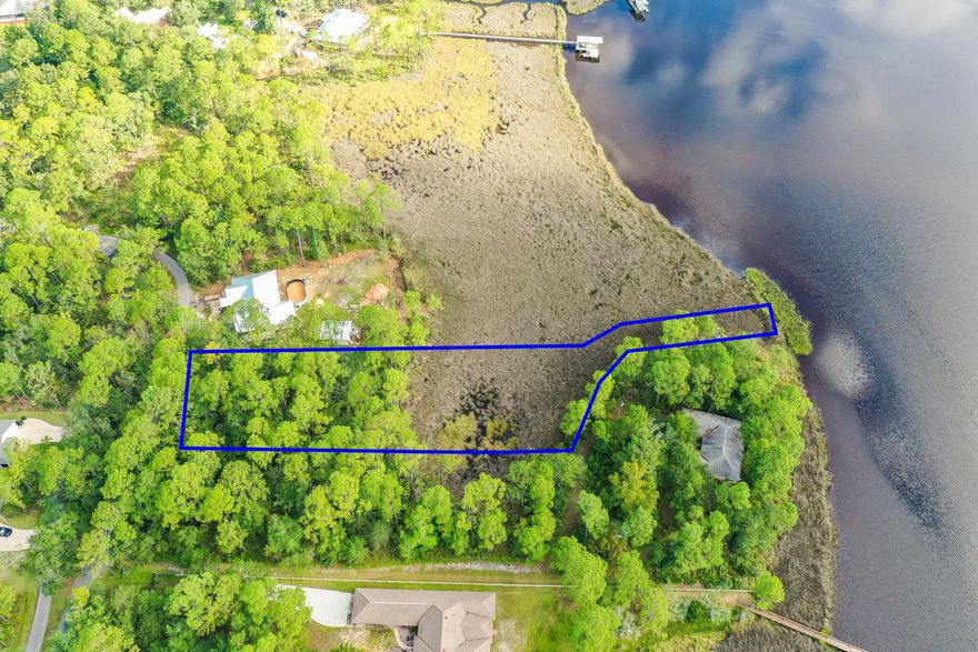 Escape the hustle and bustle of 30A and build your dream home on the tranquil waters of LaGrange Bayou.  All the dining, shopping, entertaining, and beautiful beaches of 30A are just a quick trip across the Hwy 331 bridge.  There are no HOA restrictions.  This lot is the waterfront parcel to be sold with PID 29-1S-19-23000-005-0052 which is the parcel for the homesite and gives access from Bayside Dr.  2022 taxes for both parcels was $1486. List price is for both parcels.