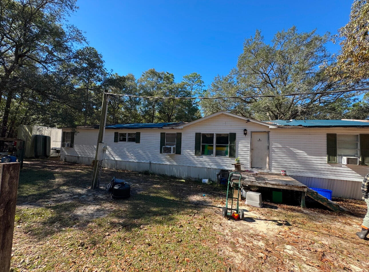 located on the north side of Crestview.  4bed /2 bath mobile home situated on 3.22 acres and creek . Investors special or perfect property to build upon.