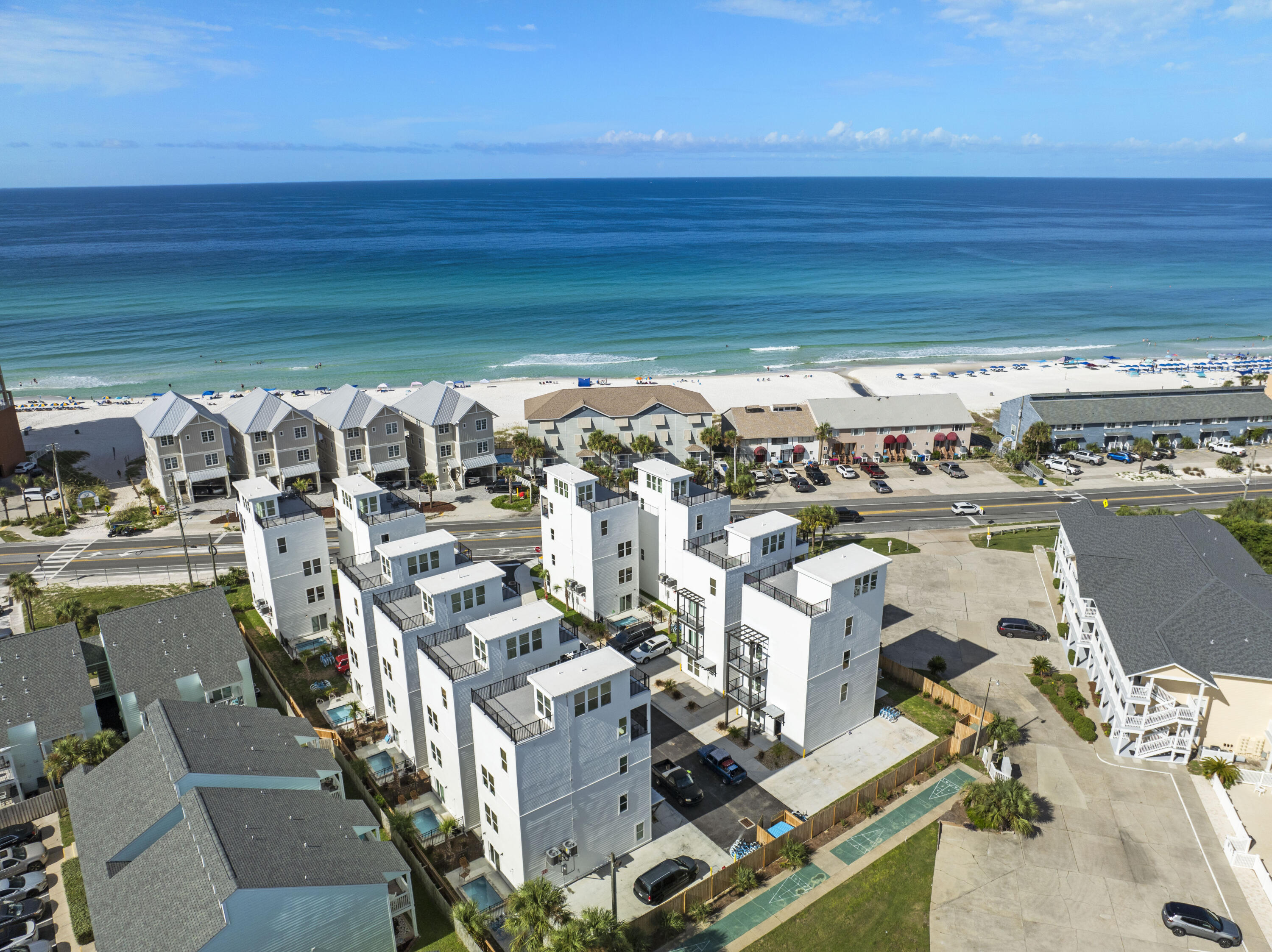 THIS IS AN INVESTORS DREAM!! Welcome to 17674 Front Beach Rd, a stunning 10 unit complex nestled along the pristine Gulf Coast. Each unit boasts 5 bedrooms and 5.5 bathrooms, offering ample space and comfort for residents or vacationers alike. Enjoy breathtaking Gulf views from every residence, complemented by private pools and rooftop terraces ideal for savoring sunsets and hosting evening cocktail hours. These homes are designed as short-term rental machines, ensuring both luxury living and excellent investment potential. Conveniently located just across the street from public beach access 72 and 73, residents can easily indulge in sun-soaked days by the beach With Pier Park, 30A and other amazing amenities just a short ride away, this location unveils a plethora of fantastic entertaining and dining options perfect for all age groups! Do not miss your opportunity to own an incredible multi-unit income producing property with everything the Gulf Coast has to offer!