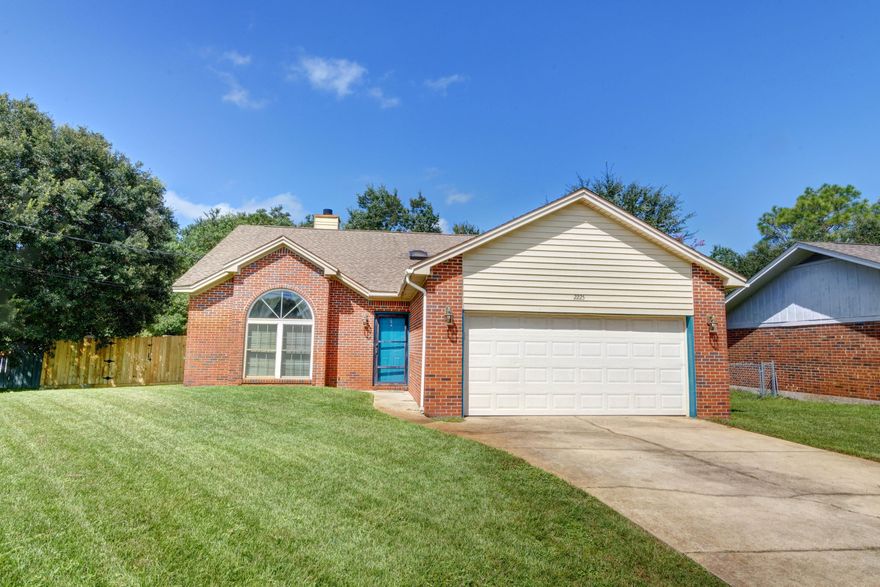 Welcome home to this serene east Navarre setting where you'll find an adorable and affordable all brick 3 bedroom/2 bath home on a half acre lot! Making this home and location even more unique is that it includes lake ownership (see survey), so feel free to manicure the current natural setting back and enjoy the view from your raised backyard deck and cabana that conveys! Walk up the drive and admire the well maintained yard and inside immediately appreciate the vaulted beamed ceilings in the living room and kitchen, as well as the two sided fireplace! Hard surface flooring extends throughout! With large windows and natural sunlight pouring in, you'll love cooking in your kitchen with plenty of room for the entire family to enjoy sitting down together! The