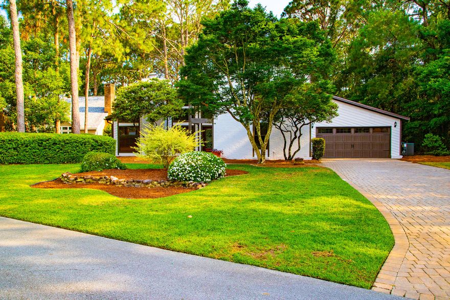 Welcome home to your Bluewater Bay residence located directly on the golf course with a pool and jacuzzi inside a charming, screened in patio area. You'll be excited about the recently painted exterior of this stunning home, but captivated by the gorgeous, updated kitchen with views of the beautiful golf course. Crisp, freshly painted interior also! This home has gorgeous Walnut floors throughout with the exception of brand new carpet on the staircase and two of the guest rooms. The family room is exceptional. With a dazzling view of the pool area and golf course, this room also has a marvelous wet bar and an under the cabinet keg fridge. The cozy fireplace is so delightful