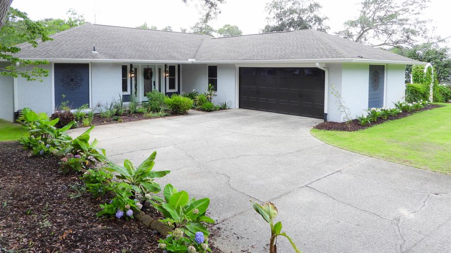 Gorgeous coastal cottage in the heart of Bluewater Bay! 3 Bed/2 Bath completely renovated! Hardwood and tile throughout, granite counter tops throughout, soft close drawers in kitchen,custom shiplap fireplace, custom Bevolo copper lanterns at entry, custom wrought iron inlay front door & sidelights, custom copper sink in kitchen, Grandin Road copper mailbox, custom recessed lighting....the upgrades go on and on! Brand new A/C unit, new PGT impact rated windows with Argon, new wind rated garage door. Property backs up to a preserved wetland and is completely landscaped giving the home a sense of a private park like setting. This home is a MUST SEE!!