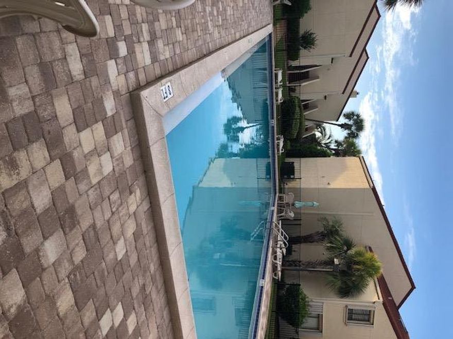 Want to live on the island? This awesome newly listed townhouse has new carpet, new fixtures, recessed kitchen lights, and will be installing new granite countertops in the kitchen this week. This is a gated community with access to a 3 minute walk down the boardwalk to the white sandy beaches. Perfect spot at a great price!