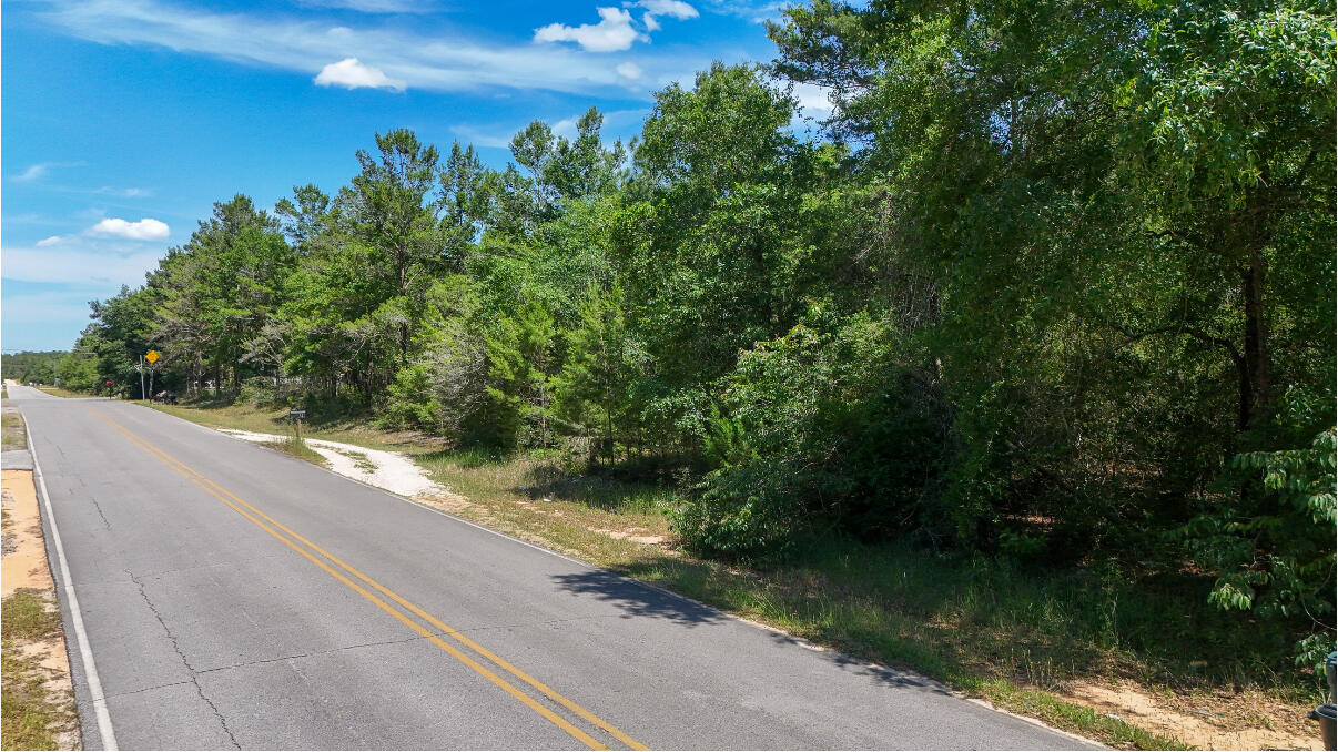 Welcome to Oakwood Hills-your gateway to relaxed Florida living! This inviting lot is located on a paved road and offers easy access to utilities, making it a breeze to start building your perfect home. Tucked away in a peaceful, scenic setting, you'll still be just 3.5 miles from everyday conveniences like shipping and dining. Craving the beach? The sugar-white sands of South Walton are only 35 miles away, ideal for weekend escapes. Whether you're dreaming of a quiet country retreat or a stylish new build, this property offers the space, location and potential to make it happen. Don't miss this chance to create something special in the desirable community of Oakwood Hills!
