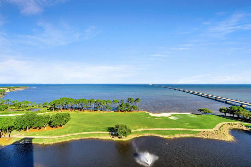Indulge in the splendor of Bayfront living at Unit 1404, One Water Place, in the gated community of Kelly Plantation.  Newly painted walls and updated designer lighting create an elegant and airy feel to this beautiful 3 bedroom residence.  Detailed luxury walk in closets emphasize organization and make it easy to get ready for the day.  Incredible panoramic scenes of the Choctawhatchee Bay from the multiple balconies and most of the rooms of the condo, offer the perfect ambiance to relax or entertain family and friends.   The turquoise backsplash in the kitchen highlights these idealic water views.  Your private elevator opens directly into the condo, ensuring a seamless and exclusive entry experience.  This unit comes with the two best assigned parking spots in the condo.