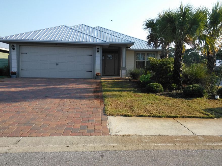 This open concept, split floor plan home boasts beautiful walnut hardwood floors throughout the living areas and all four bedrooms. The two car garage has an additional door leading to the back yard that makes accessing the lawn well, pump and automatic sprinkler system a breeze. The huge kitchen provides both a breakfast bar and space for a table and chairs. The home also features a formal dining room. All appliances are stainless steel and convey with the home including the washer, dryer, and refrigerator. Eagle Bay is conveniently located only 3 miles from Sacred Heart and Grand Boulevard. Access to Choctawhatchee Bay is only two blocks away.