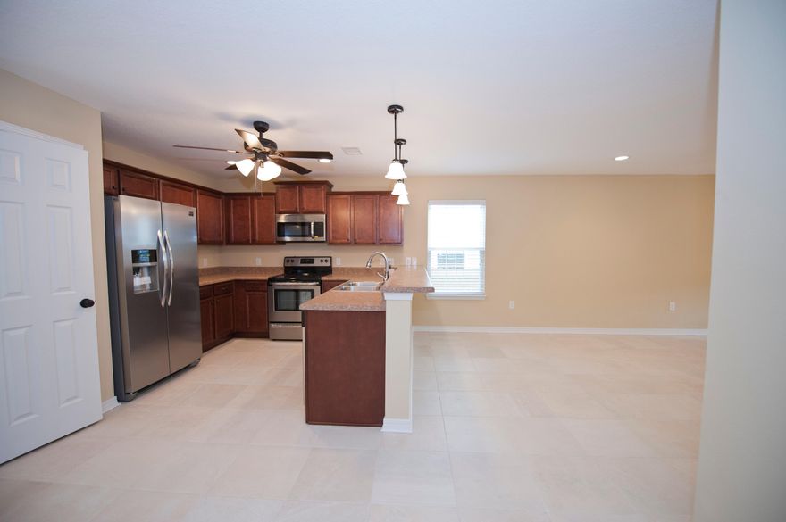 New Construction under 200k. Light and bright open floor plan. Inviting living room opens to the dining room and kitchen with stainless steel appliances to include side by side refrigerator. Downstairs Master Suite with walk in closet, dual copper sinks, garden tub, and separate shower. Downstairs has guest half bath and laundry. Upstairs are 4 additional bedrooms with nice size closets. Enjoy the covered lanai with access from kitchen opening out to the privacy fenced back yard that you don't have to cut. Lawn cutting is included in your HOA dues. Front porch offers stone columns and lush landscaping. Seller to pay up to $2600 of buyers closing cost with the use of a preferred lender. Pictures of home are not of actual home colors and finishes may vary. Estimated completion mid October