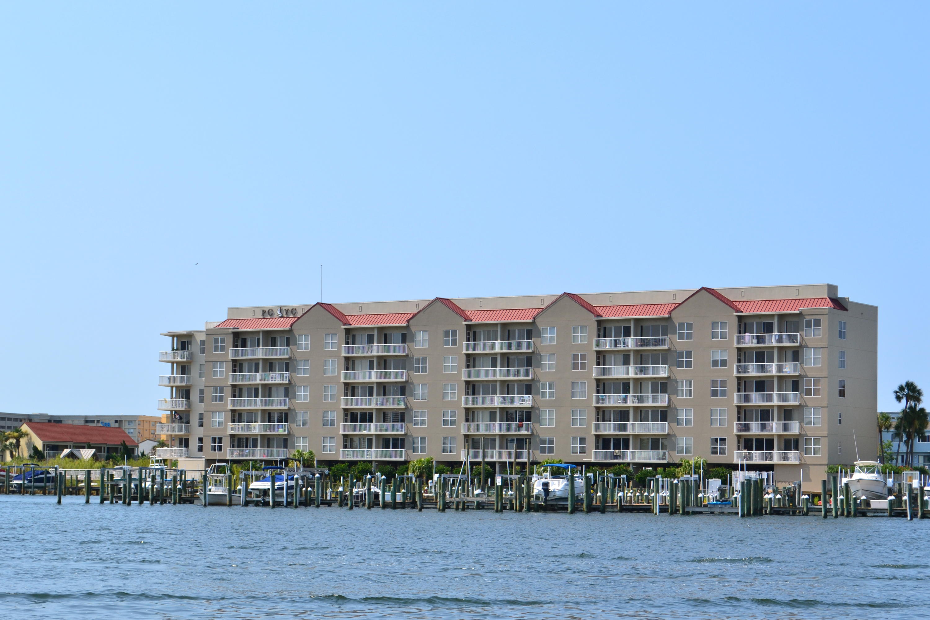 Tremendous views from this 3rd floor condo on Okaloosa Island, PLUS BOATSLIP! Renovated unit with over sized rooms with separate laundry room. Master bedroom. kitchen and living dining rooms have views of the bay. Owner has replaced the toilet and tub in Master Bath plus added Travertine in the Master Bath and Granite on the Kitchen cabinets plus updated all the plumbing fixtures. All appliances have been replaced and updated. The kitchen has views of the Bay and an over sized Refrigerator. There is boardwalk access to the Gulf of Mexico beach across the street. The complex offers a sound front pool, and hot tub and has a parking garage. 18 foot deep water Boat slip conveys with this unit. Call today for your private viewing.