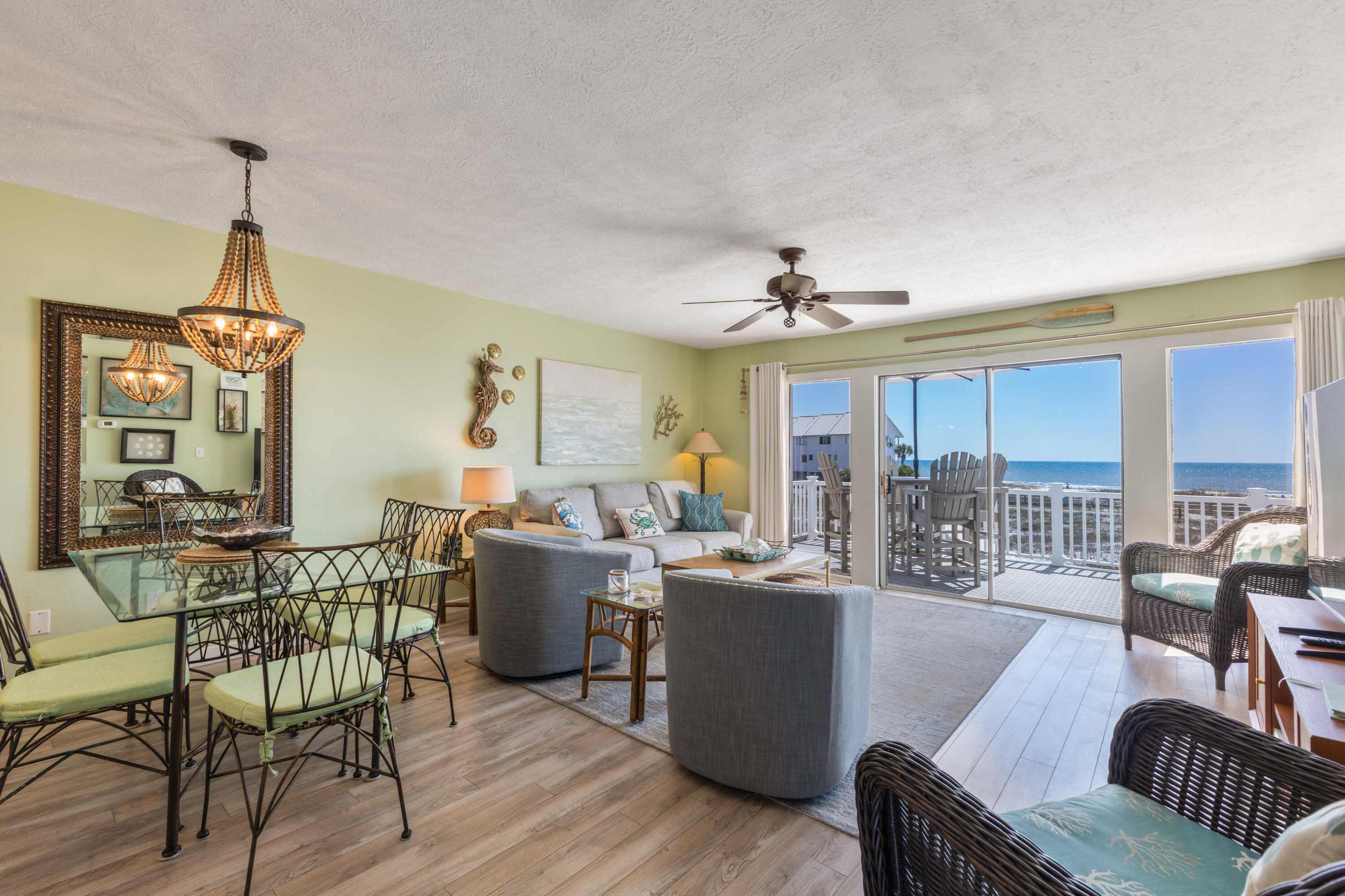 BIG views in a small complex. This 2Br/2.5Ba Townhome in Seagrove Beach is less than 100 yards to the sugar-white sand beach access. Magnificent Gulf views from the open living/dining room combination with plenty of seating. The kitchen with Stainless Steel appliances, tile backsplash, granite countertops and storage pantry is a great place to prepare breakfast, lunch, a quick snack or a delicious dinner. Need to grill, use the community grill just across the parking lot. Enjoy your meal at the dining table or use the additional seating at the breakfast bar. Another dining option is on the deck under the umbrella overlooking the crystal-clear waters of the Gulf. A convenient downstairs half bath is located just off the kitchen. The primary suite with King Bed on the second level includes a spacious bedroom and a remodeled bath with walk in shower, granite countertop vanity and tile floors. Slide the glass door open and enjoy the private balcony with unobstructed Gulf views for your morning coffee, evening cocktail or just sit and listen to the waves before bedtime. The second bedroom has twin bunks, a Queen Bed and upgraded en suite bath with tiled tub/shower combo, quartz countertop vanity and tile floors. An owner's closet is conveniently located in the upstairs hallway. Covered parking, laundry room and additional storage are located below the unit with additional parking spaces as well. A shower pad is conveniently located at the foot of the steps from the deck. If you're looking for a rental ready property or a true second home Beachfront Townhomes Unit #10 in Seagrove Beach is a hidden gem offering a perfect blend of relaxation, adventure, and coastal charm along Scenic Hwy 30A. Unwind on pristine beaches, shop at charming boutiques, savor delicious cuisine, enjoy the natural beauty of nearby state parks and Coastal Dune lakes and immerse yourself in the local culture, Seagrove and Beachfront Townhomes has it all.