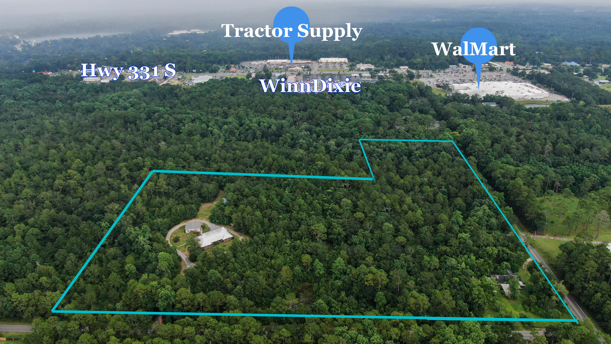 Unique opportunity with many, many development possibilities. Located appx 1.5 miles from I-10 and a mere 30 min to the beaches of Walton County, one of the fastest growing counties in the US. Zoned Estate Residential in Walton County (1 per 5 acres). Property is surrounded by city of DeFuniak Springs with possibility of annexing. Per city planning, one may annex while changing zoning to R2 simultaneously (16 per 1 acre). Previously used as a handicap compliant home with adjacent warehouse used for owner's office supply business. Property would be ideal for apartments, duplexes or a new home community. City water is available with public sewer less than 500 ft away. Buyer to do all due diligence and find out any matters of importance. Maps, city & county zoning, etc are in docs section.