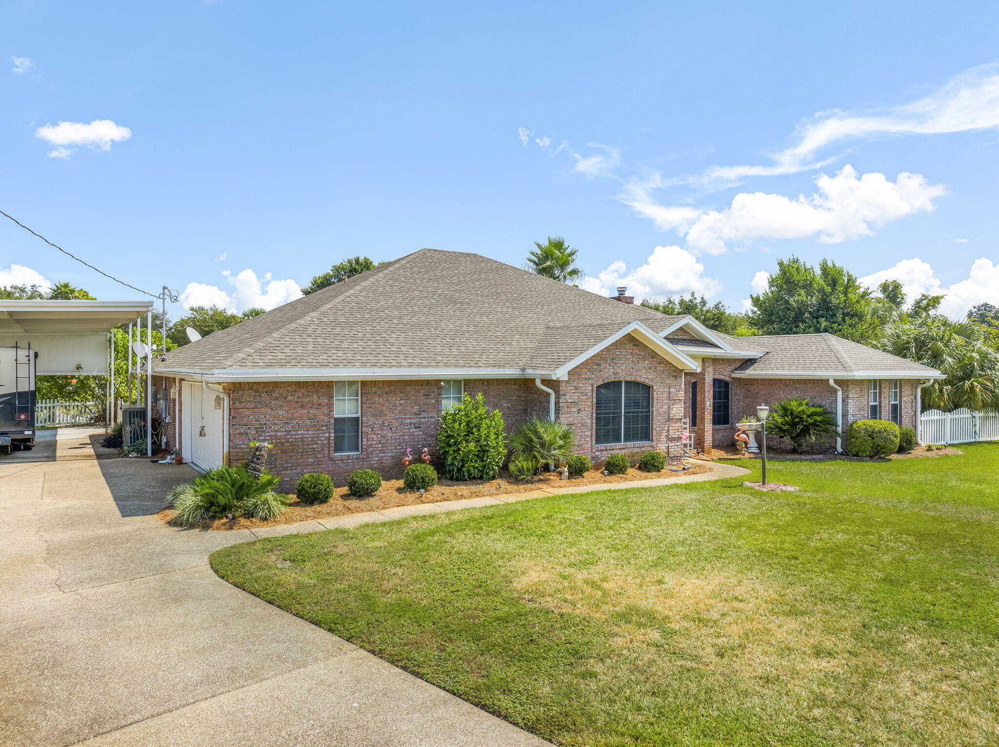 Waterfront Home with Bay Access in Kings Point! This all-brick residence offers a lifestyle of comfort and convenience with multiple sought-after features. Enjoy your own private in-ground saltwater pool and a spacious RV pole barn equipped with a 30-amp service, perfect for recreational vehicles or boat storage. Step inside to discover tall ceilings, grand Livingroom with built in shelving, a Florida room that has been fully heated and cooled, serving as a second living space or Family room with panoramic windows overlooking the beautifully landscaped backyard. From here, you can take in views of the pool, canal, and outdoor entertaining space. The backyard features Saltwater pool, a covered pergola perfect for a grilling station and open space for lounging poolside making it an ideal setting for cookouts, gatherings, and relaxed Florida living. This Beautiful setting backs up to a canal with seawall and dock access, making it ideal for waterfront living. The interior includes a cozy gas fireplace, ideal for creating warm holiday gatherings and a classic focal point for seasonal decorating. The kitchen is designed with custom cabinetry, pull-out drawers, and smart shelving to maximize organization. The primary suite offers a luxurious retreat with a jetted tub, separate shower, and a well-designed layout. Additional highlights include a sprinkler system, a well and septic system and propane gas, and a two-car garage. For added convenience, this property can be sold furnished, with only a few sentimental pieces excluded (please refer to Realtor remarks for details). Located in the desirable Kings Point community, this home is close to shopping, dining, and local schools. It is approximately a 25-minute drive to Tyndall Air Force Base and about 20 minutes to the Naval Support Activity Panama City, making it an excellent option for those needing convenient access to military installations.
