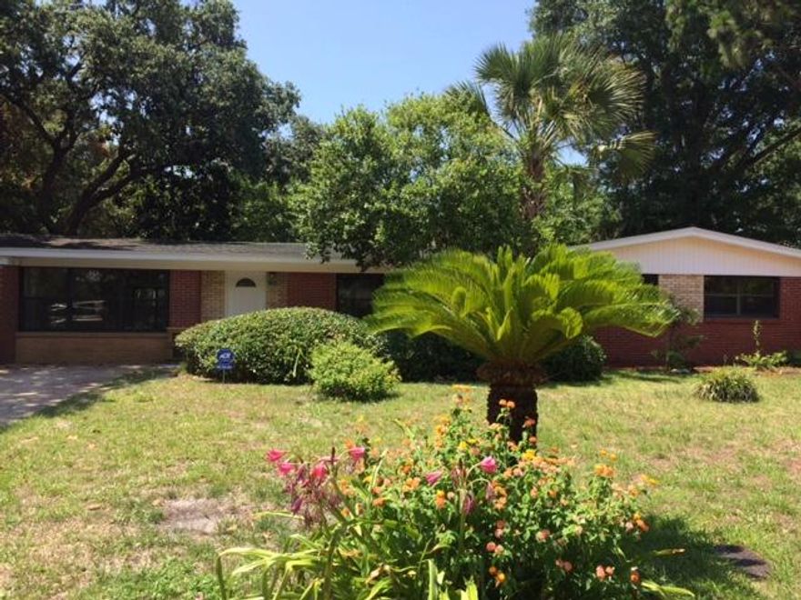 MOTIVATED SELLER! Beautifully remodeled home. Brand new kitchen with cabinets, appliances, and granite counters. Full bath off of master has been beautifully transformed. The hall bath also completely remodeled. Walls were removed to create a pleasing open concept living space. Brand new tile flooring except bedrooms which have new carpet. Freshly painted and pressure washed. Two sets of triple sliding doors lead to a partially covered lanai and very nice yard with mature landscaping. A lawn pump and sprinkler system with a timer make lawn care a breeze. The roof is only a few years old. The windows are newer thermal pane and the wiring is copper and has been upgraded. Home is set up for an alarm system