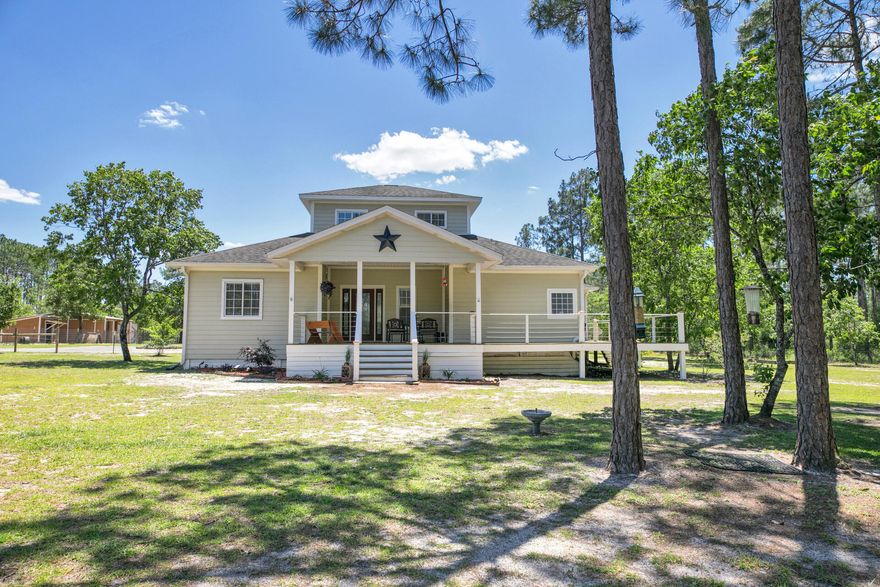 Quiet Country living less than 10 minutes to Publix Shopping Center, on 4.35 Acres with a 2378 Sq. Ft. MAIN HOUSE built in 2005, with 3 BR + Office, 2 Bath PLUS a 2 BR/ 1 Bath GUEST COTTAGE. Main house has Vaulted Ceiling in Living Room and Bamboo and tile flooring throughout - no carpet! The Dining room is light and bright, the Kitchen has 42' Cabinets, Double Oven, newer French Door Refrigerator with bottom drawer freezer and large Pantry. The large Master Suite also with Vaulted Ceilings, Double Sink and Jacuzzi Tub, Separate Shower and Walk-in Closet. The Split floor plan has 2 guest bedrooms, an Office and a guest bath on the main level and a large bonus room upstairs. Interior and outdoor speakers. Guest Cottage has a large living/kitchen with a vaulted ceiling, 2 BR, 1 Bath