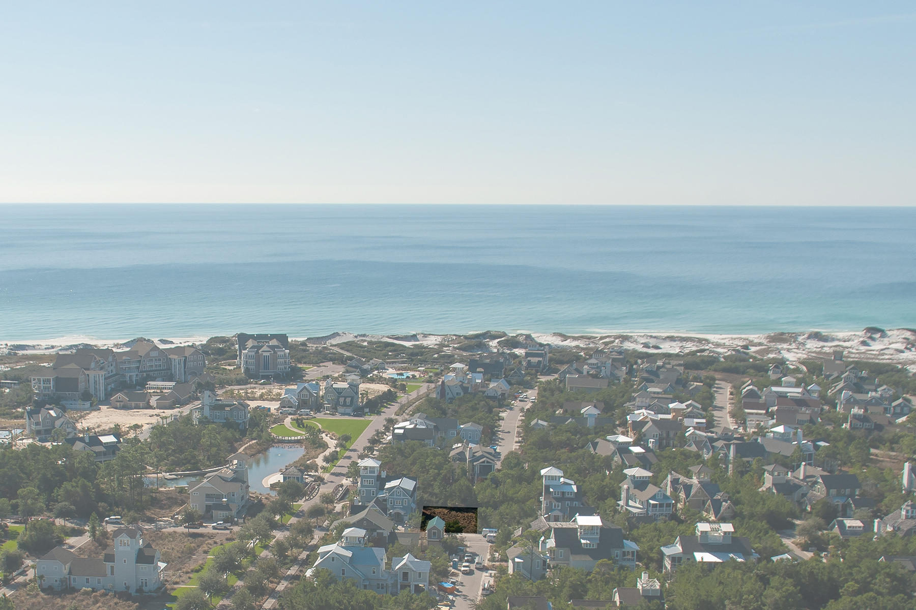 Achieve southeasterly views of the Gulf of Mexico from the 4th floor tower of a home conceptualized specifically for this lot in WaterSound Beach. Deep covered porches along the back of its 1st and 2nd floors would overlook peaceful common area where a neighborhood trail leads to the nearby yacht pond and beyond to the dune side pool. Beach access is only a short stroll away. This gated, resort community along the popular east end of Scenic Highway 30A enjoys a one mile stretch of unprecedented beach front, presided over by beautifully preserved, mountainous dunes laced with boardwalks. Amenities include two neighborhood pools, manicured putting greens, security patrol, as well as an on-site fitness center and post office.