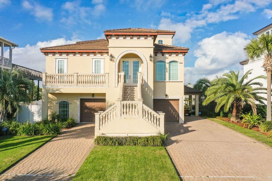 Remarkable outdoor spaces across four levels characterize this Holiday Isle home that features stunning views of the Gulf of Mexico and Destin Harbor. A four-bed, five-and-a-half-bath home with more than 4,900 square feet of living space, this coastal retreat is built for a water enthusiast's lifestyle with an 80-ft. deepwater boat dock and lift. Built in 2006 and never placed on a rental program, this home has a recently-added lap pool with spa and is only a short walk to beach access. Concrete block construction with a concrete tile roof, three levels of this smart home-enabled property are accessible via private elevator.