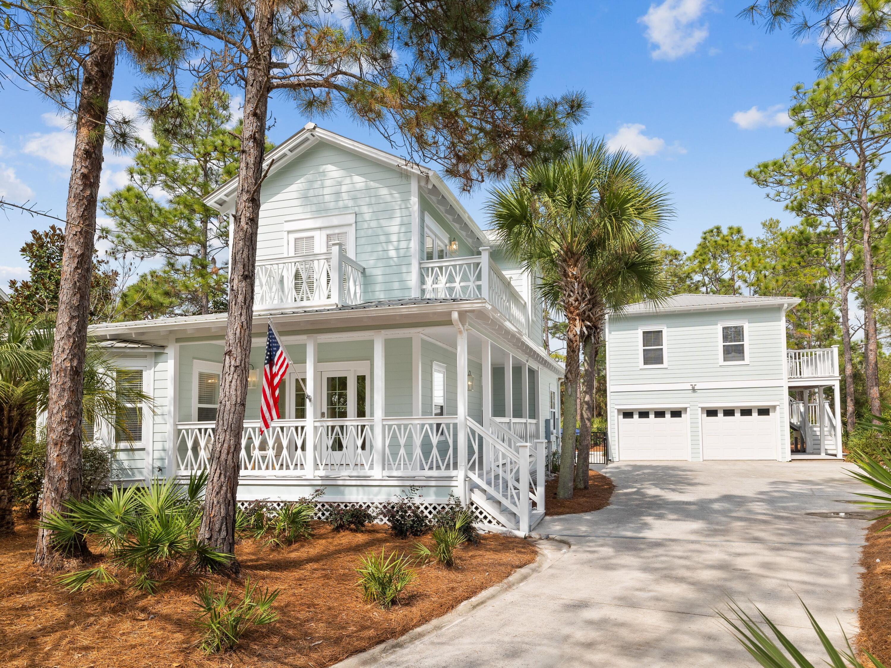 Newly remodeled, this lovely home exemplifies the perfect balance between comfort and luxury. This stunning coastal property with its covered porch and multiple balconies shares a generous quarter-acre lot with a two-car garage and guest quarters above. The open floor plan is a bright and airy space for dining and relaxing with beautiful hardwood flooring. Chefs will be keen to check out the redesigned gourmet kitchen which comes with gleaming white appliances and sleek quartz counters. The island is boldly clad in veined quartz providing a central hub for the apron sink and dishwasher. The dining table sits in its own bright nook beneath a feature pendant light.