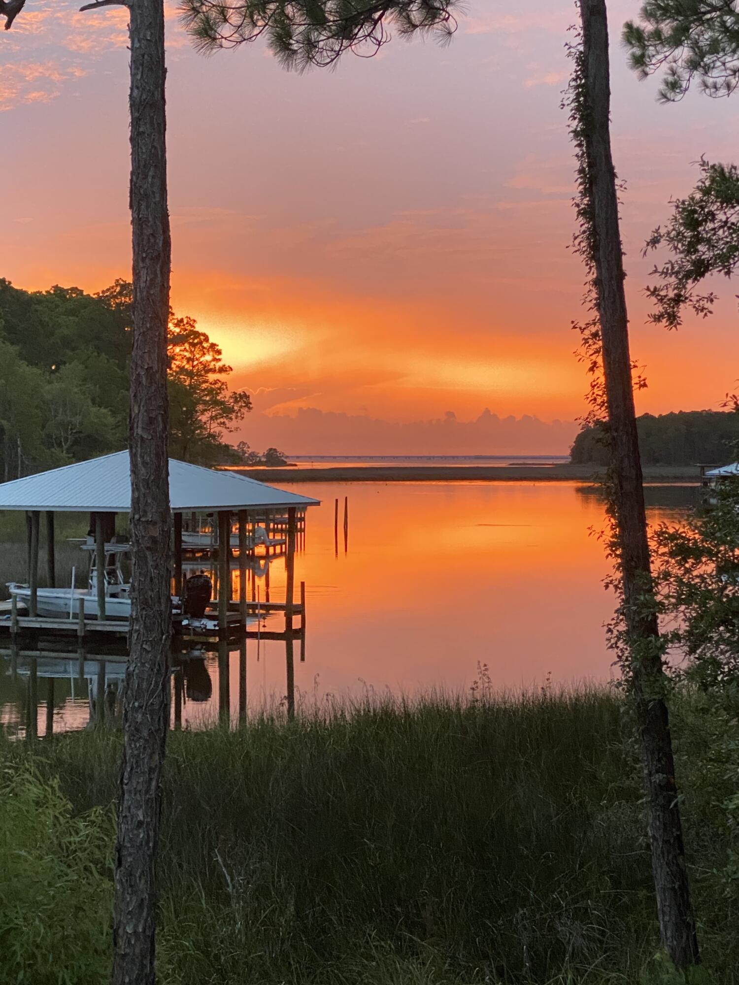 Charming WATERFRONT home on coveted Eden Drive HAS THE VIEW YOU ARE LOOKING FOR!!!!!This professionally landscaped/irrigated lot(.52ac) is fenced to keep the furry family safe!A true dream dock made of Trex decking has 2 lifts, one covered and one not. PLUS a fabulous sitting area to enjoy the sunsets/bonfires.The newly updated home has 3 bed/2 bath and two living areas. stainless steel appliances in the kitchen, new HVAC, and lots more. The nearly 1,000 sq/ft of finished GARAGE is AWESOME! Put your long boat or 2 in there and a few cars....or easily convert to more bed/baths. The back yard w/ fieldstone fire pit and porches all have the same unbelievable view. If a pool is your thing.....there's room!! This one checks all of the boxes. Owner is lic.RE agent doing business in FL