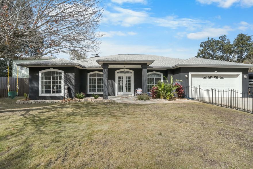 Owner financing available! 20% down with a 5.5% interest rate! Welcome to this beautifully updated 4-bedroom, 3-bathroom Florida home, offering the perfect blend of style, functionality, and location. From its thoughtfully designed interior to its stunning outdoor spaces, this home is an exceptional find.Interior HighlightsStep inside and experience an open floor plan with soaring ceilings, including elegant trayed ceilings in the living room and master suite. The living room features a cozy gas fireplace, perfect for relaxing evenings. The kitchen and bathrooms boast luxurious granite countertops, while the kitchen is equipped with sleek stainless steel appliances to make cooking a pleasure. The master suite is a true retreat, featuring a deep walk-in closet with built-in shelves, a spa tub, and separate sinks for added convenience. The home also features new LVP flooring in the bedrooms and office, combining durability with modern style. Fully furnished with over $25,000 in tasteful furnishings, this home is ready to welcome you from day one.

Exterior Paradise
The outdoor spaces are nothing short of spectacular. The backyard is a private oasis with an inground pool that comes with a lifetime warranty, a custom 3-hole putting green with pet-friendly turf, and an outdoor kitchen complete with a Bull grill and Big Green Egg smoker. The entire backyard is enclosed by a privacy fence for added peace of mind.

The front yard is equally impressive, featuring lush Zoysia grass and a decorative iron fence that ensures safety for kids and pets. The oversized driveway can accommodate an RV or boat, adding versatility to this property. The home also includes a dehumidifying water heater and fresh interior and exterior paint for a clean and updated feel.

Prime Location
Perfectly situated just 0.7 miles from Harbor Walk Village, 0.6 miles from the Destin Marina, and close to the iconic Dewey Destin restaurant, this home places you in the heart of the action while providing a serene retreat.