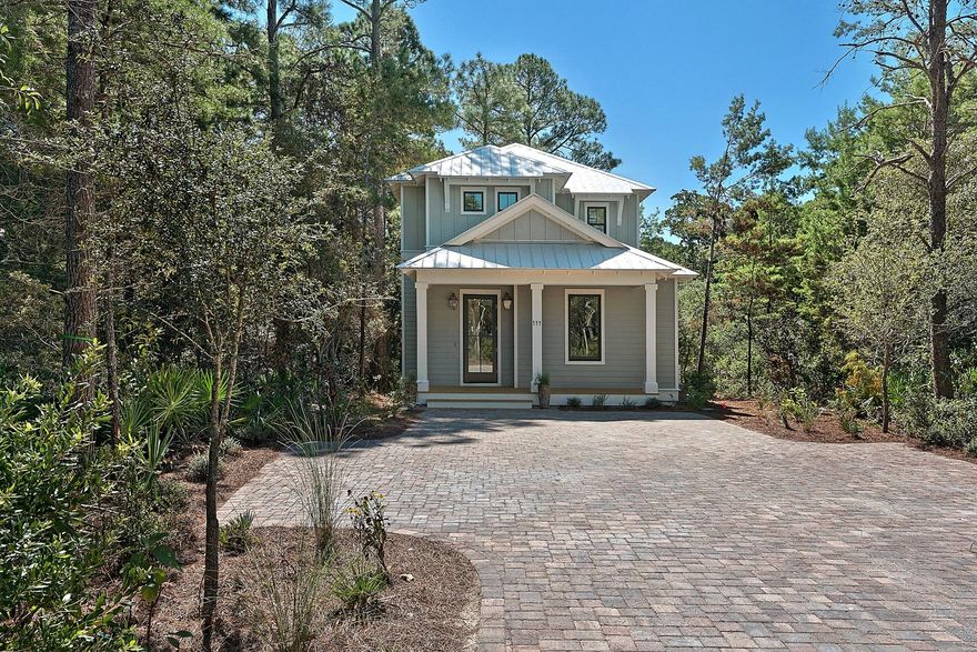 This beautiful 3 bedroom, 3 1/2 bath home is located in The Hammocks, a secluded gated neighborhood located near Watercolor and Seaside. This community is a great primary home location or vacation home or a great rental opportunity . There are no rental restrictions. This home has all the details that you desire in a home including a master bedroom on the first floor and a master bedroom suite on the second floor. There are large screened porches and balconies to enjoy the serene setting. The floors are solid reclaimed wood.Beautiful gas lanterns on the front porch invite you in. The kitchen has Bosch appliances including a gas range. Quartz countertops in the kitchen and bathrooms.The closets have custom built shelves. There is a Rinnai tankless water heater and laundry rooms on the