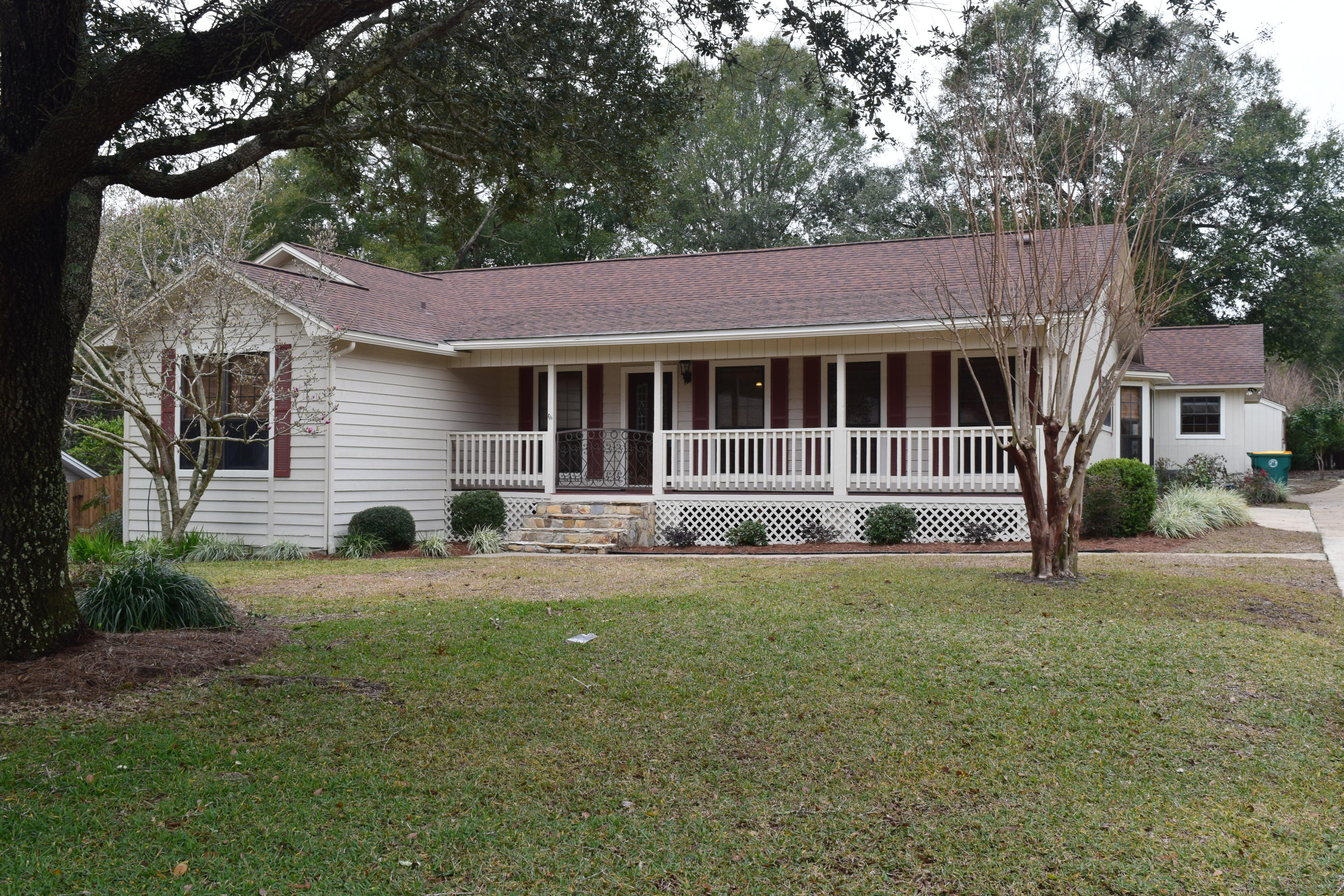Wood burning fireplace, lovely wood laminate flooring, large bedrooms. Extra large deck with railing. Front porch is gated and looks great!