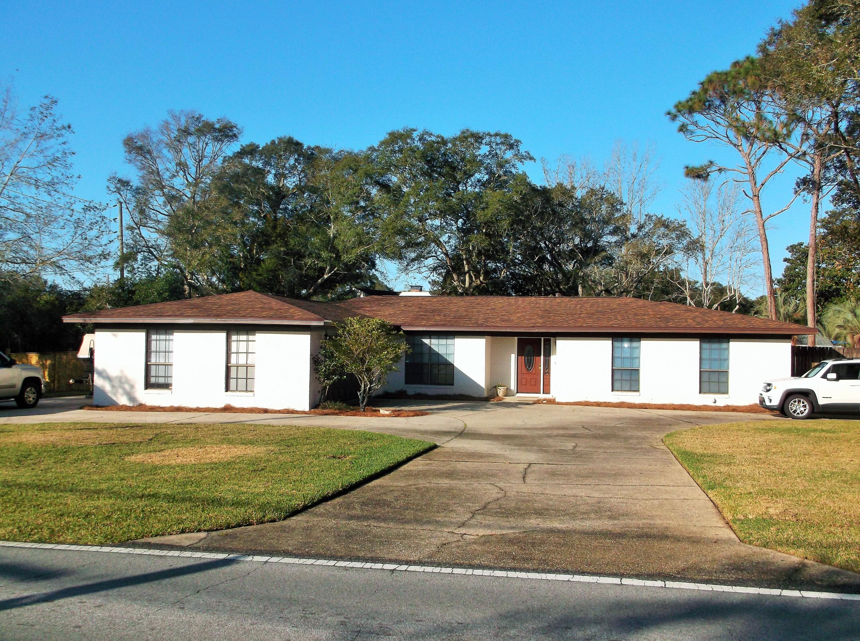 Brick home on corner lot with circular driveway & extra parking for boat or RV, with RV hookup. Double gates to access backyard that has a 20x18 detached 1 car garage w/10ft lean to on concrete pad with power and water to it so could be a workshop or man cave. New Roof in 2021, exterior painted in 2022, 2014 AC; new front door. Newly sodded yard and new irrigation system w/rain sensor & mobile app., some new privacy fencing w/double gate to access backyard. Screened patio and a nice sized backyard for you to enjoy. Interior has 4 bedrooms and 3 full baths, 2 baths have been updated. Breakfast nook area and formal Dining rm area with columns. Tile floors in kitchen/nook/DR and baths. Kitchen has granite countertops and opens into the living area. Gas Fireplace in LR.