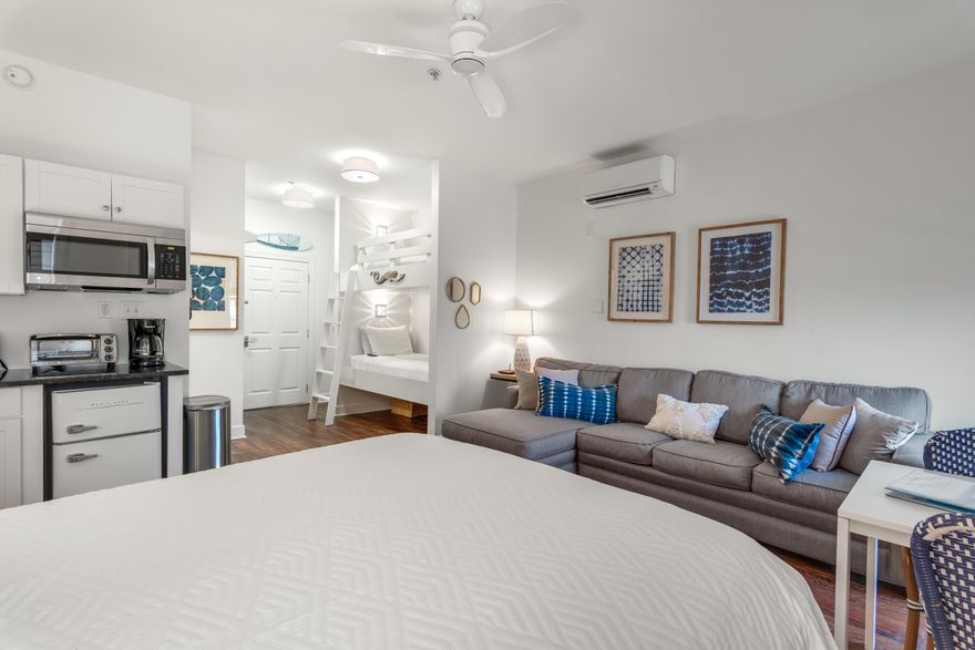 This beautifully appointed, fully-furnished studio in the Village of South Walton lives much larger than its 363 square feet with room to sleep six thanks to built-in bunks -- a rarity in studio units. With over $37K in rentals booked so far in 2022, this makes for an excellent investment opportunity. This unit's location is key, situated between Rosemary and Seacrest Beach and a short bike ride to Alys Beach, giving you plenty of fine dining and shopping opportunities to explore. The interior features one queen bed, one set of bunks, a queen sleeper sofa, bathroom and mini-kitchenette that includes storage cabinets, a mini-fridge, toaster oven, microwave and sink with brand new water heater.  Outside, enjoy free shuttle service to the deeded beach access, two community pools, hot tub grilling area and laundry facilities on the first floor. New furnishings make this unit turnkey and ready for quick getaways in this popular area which allows walkability to numerous amenities including on-site bike rentals, shopping, outside entertainment, dining and much more.