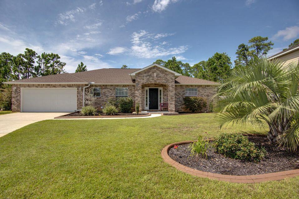 *****OPEN HOUSE *****Friday 5/23 @ 12p to 3pm *********Interest rates have you down? How does 3.25% ASSUMABLE VA loan on a sound-front community brick home with pier, beach, nature trail, pool and a Kayak launch sound? Have your attention? Keep your swimmers on because the excitement does not have to end once the sun goes down. The current owners have simplified moving the excitement from the water to the large yard simply by adding an outside lounging area outside of the large 10x32 screened in back porch. Rinse off under the outside shower, light up the grill, and sip on a brewski while lounging around the outside fireplace with friends and family. If you must call it a day to prepare for your week, move inside to a spacious 2081 sq ft open floor concept which allows you to transition easily by offering 3 bedrooms, two full baths, with a bonus room showcasing bamboo flooring and French doors that can be used as a study, home office, play /game room, or extra bedroom. The Kitchen boasts maple crowned cabinets, stone backsplash with matching island, stainless steel appliances, large pantry and a breakfast nook. Need extra shelving? The utility room offers wooden shelving and cabinets with ample space remaining to design your personal functioning area for chore day. Two bedrooms on the right side of home share a full bath with all three showcasing a beautiful wood appearance grey porcelain tile. The master bedroom boasts bamboo flooring, a private entrance to the screened back porch, with a master private bath with double vanity, full size walk-in shower, walk-in closet, and wood appearance grey porcelain tile. If you need a little more convincing that you have found the right home, Sound Hammock is a community off of Hwy 98 which offers easy commute to Pensacola, Milton, Mary Ester / Ft Walton Beach which seals the deal by providing easy, fast accessibility to all shopping, the military bases, eateries, entertainment, schools, and nightlife. Please note: renters are in process of packing and moving, professional photos to come, but no need to wait, call and schedule your walk through of your future new home