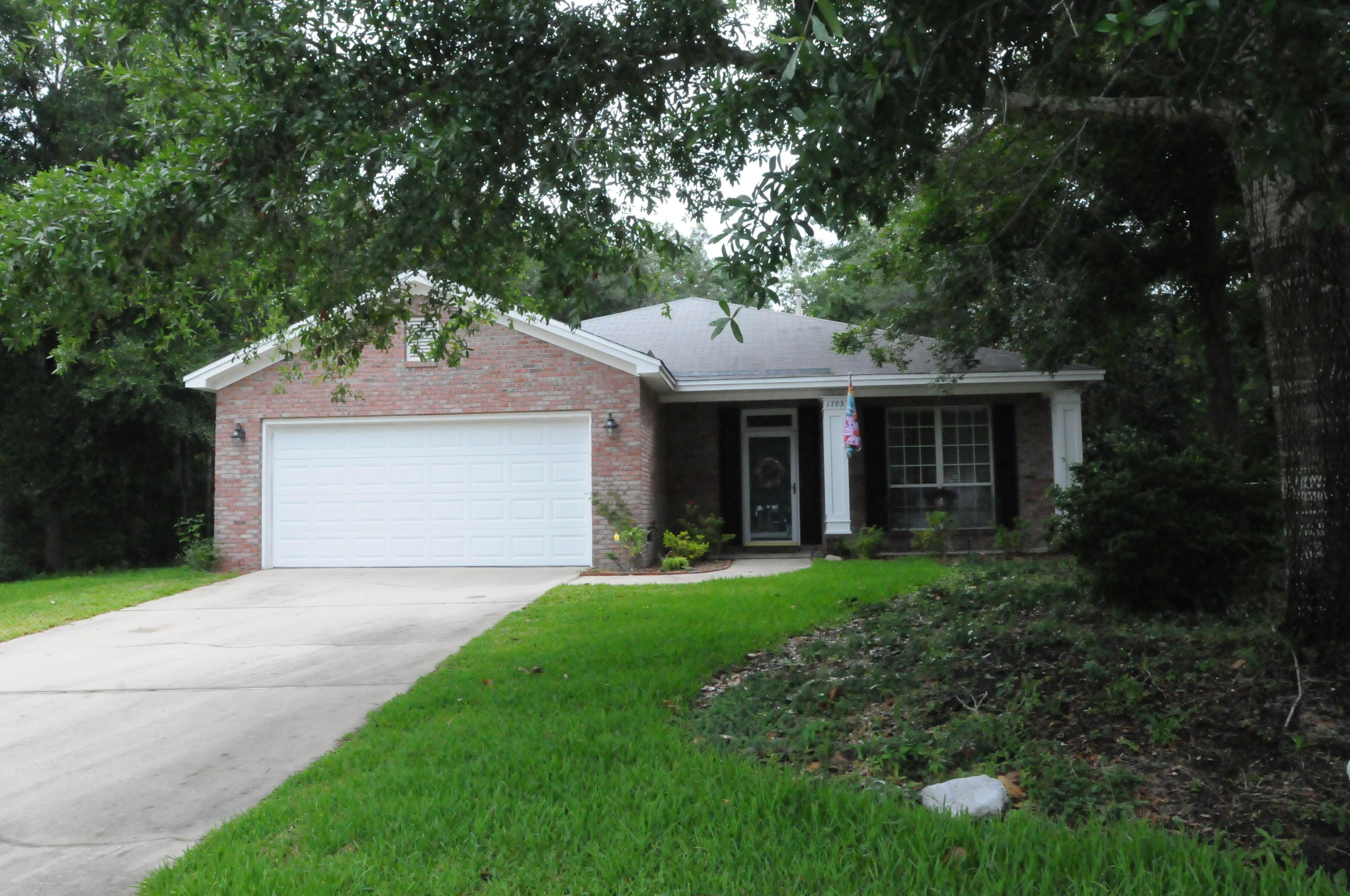 Beautiful Randy Wise brick home located on a .42 acre cul-de-sac lot in Niceville. This home was built to age in place with roll in custom master shower, larger doorways with tile and bamboo floors throughout. Transom windows brings in extra light and are a wonderful upgrade. The open kitchen with ample cabinets features new stainless steel fridge, oven and dishwasher. Dining room, family room with additional dining space and fireplace with custom built-ins, wonderful large screened patio room overlooks the oversized back yard. Extensive yard work has been done to enjoy the outdoor space, fenced in perfect for pets or kids. Backs to wooded area for extra privacy. Make your appointment today to see this lovely home before it is gone!