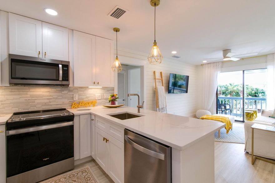 WOW!  What a Beauty!!  This Beach Condo has been tastefully remodeled with attention to detail, between the Soft colors, Recessed Lighting and Shiplap walls it feels like Spring Air.  Live in this Fantastic Pad or use it as a second home and/or vacation rental, all options are available to You!  Holiday Isle is a Water Lovers Paradise with 2 Deeded Beach Access areas and 2 Public Beach areas Norriego Point for Fireworks and Boat Watching and Osteen Beach for fishing the Jetties.   You can walk, bike or take a golf cart to your favorite hangout on the Island OR you can catch the Water Taxi to the Destin Harbor for Nightlife, Restaurants and Shopping.  .  This is a BRAND NEW CONDO...New Shaker Style soft close Cabinets, New QUARTZ countertops, New Furnishings and 55' TVs, New Floors, New