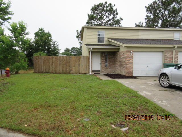End unit townhome. All dressed up and ready for a new family!!! Freshly painted thru out. New carpet, tile and laminate flooring. All bedrooms are upstairs with 2 full baths. Guest 1/2 bath conveniently located on first floor for guests. Washer and dryer conveys but not warranted. This home is just minutes from both bases, shopping and beaches. Owner will assist with closing costs with acceptable offer and will provide a one year warranty. Easy show...