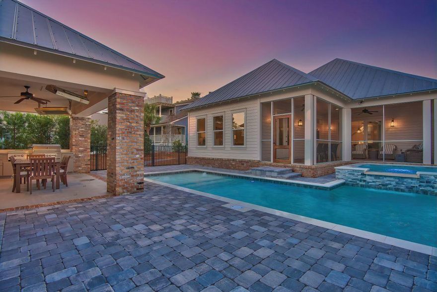 Elegant craftsman design contrasted with exemplary coastal decor define this well positioned beachside retreat primely located 50' above sea level in the heart of Blue Mountain Beach. Recently built in 2016 and extremely well maintained, this property is a highly unique offering located on an oversized homesite with 230'+ in depth offering ample privacy and heavily amenitized including a newly built resort style pool area & adjoining spa as well as a 20' X 25' entertainment pavilion which features three commercial heaters, an expansive outdoor kitchen including a gas grill & side burner, surround sound, outdoor dining and a gas fireplace with outdoor television.
