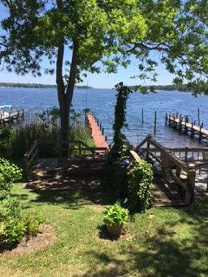 CONTRACT FELL THROUGH!! BACK ON MARKET and being sold in ''as is'' condition for a great price!! Come join in the water fun at Water Oaks!! Relax among the ancient oaks in this breathtaking home on Boggy Bayou. Sail directly to the Gulf or simply cross the street to Eglin' two golf courses. This beautiful end unit with it's Old Chicago brick siding and Spanish tile roof, it has a large lot that rolls out to Beautiful Boggy Bayou, with a shared dock and deep enough water for any sized boat. There is a wonderful screened in porch for sharing in the romantic sunsets or watch the fireworks with friends and family. The home is open and flows from the entry right to the gorgeous waterfront view.