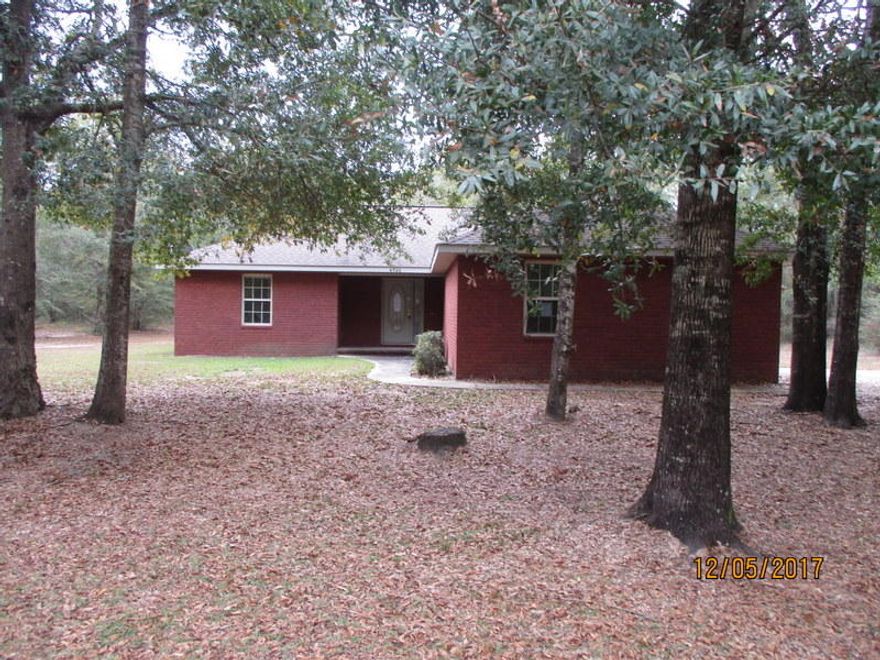 A little bit of city and a little bit of country is one way to describe the REO property located minutes from the interstate in Holt and a short drive to Hwy 87. Built in 2007, this split bedroom 3 bedroom 2 bath home has all brick exterior, side entry 2 car garage and rests on approx 2.3 acres. Inside, home has tile in the wet areas, carpet in the bedrooms, vaulted ceilings, fireplace and, central heat and air. Home will not qualify for all types of financing. Call today!