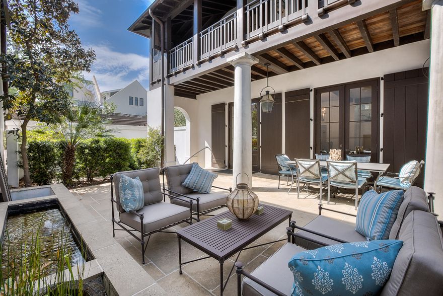 First time to the market, this Eric Watson/Architect, home located on the boardwalk, south of 30A in Rosemary Beach, constructed by OB Laurent is ready for you. The arched doorway entry from the boardwalk leads you to the elevated, private courtyard with lighted fountains and a covered loggia that connect you with three massive French doors to the Living, Dining and Kitchen areas. This seamless indoor outdoor living is complemented by Peacock Pavers inside and out, solid mahogany doors with Phantom screens built into the molding of all exterior doors, Kolbe windows and architectural molding throughout. The kitchen counters are Jerusalem Gold limestone, Viking range and microwave Subzero refrigerator, Bosch dishwasher, Shaw farmhouse kitchen sink and glass front cabinetry.