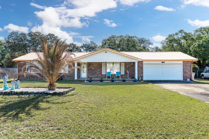 This cozy home has been rehabbed and is ready for its next chapter as a primary residence or investment. You're welcomed by a large yard and a driveway long enough for an RV *and* boat! The front door opens and it's all about light and bright. Grey porcelain tile runs throughout the home. The black granite countertops and stainless steel appliances in the kitchen add to the clean lines. The guest rooms are on the left side of the hall, with the full guest bath on the right side and the primary bedroom at the end with its own en suite. The massive back yard has a fire pit ready for you to enjoy, but there's plenty of room for a pool, outdoor kitchen, or maybe even a guest house. No HOA, no flood insurance required. Sellers are packing, pardon the boxes. Roof, WH, and HVAC all updated!
