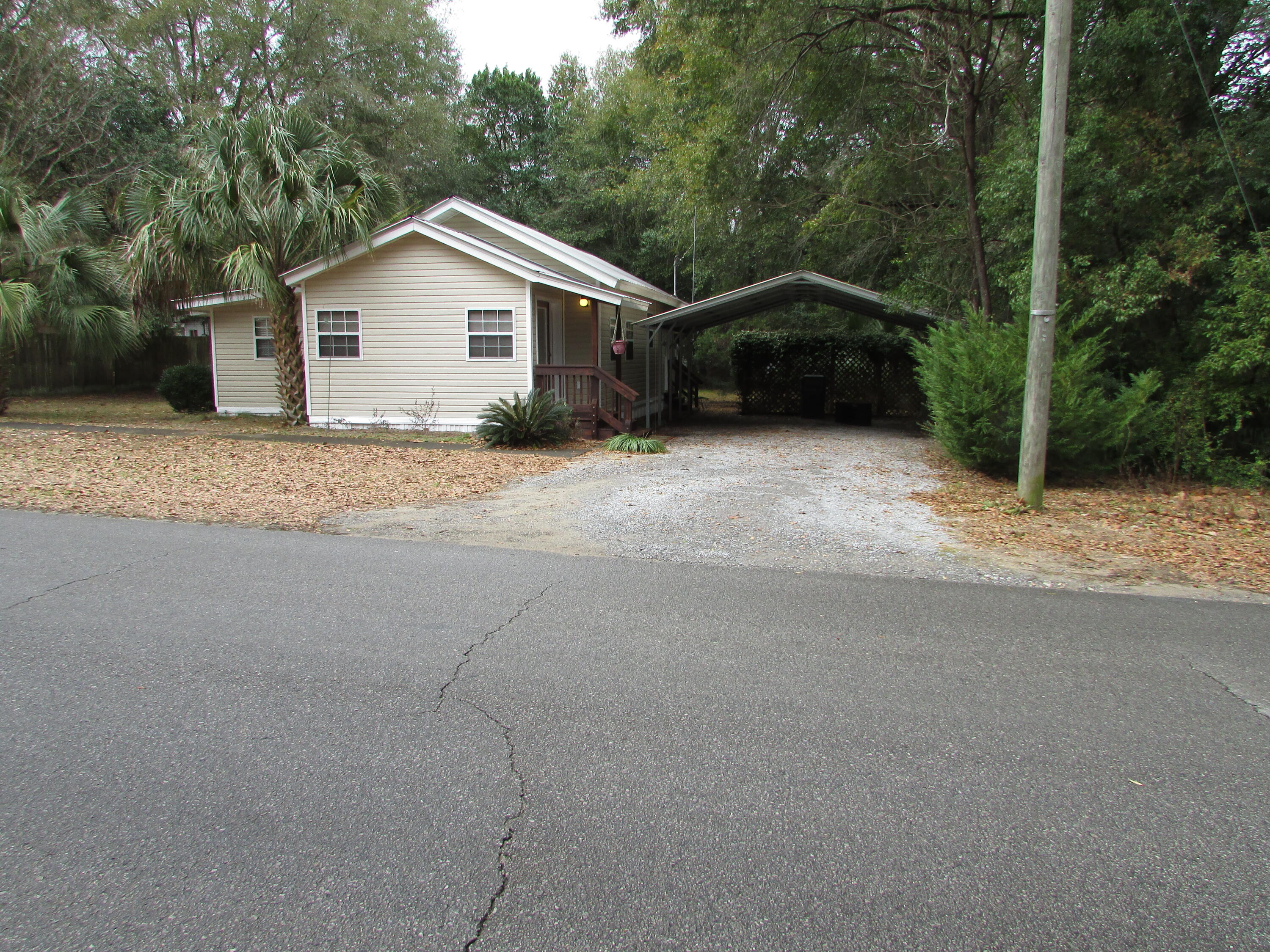 Lovely cottage in the growing town of DeFuniak Springs. Located within walking distance to bustling downtown and all of its activities. Don't let the build date of 1915 fool you. It has been remodeled and is up to current codes. This 2 bedroom and 1 bath offers the perfect amount of space for a small family or individual. All appliances are conveying with the sale of the property. It has an open kitchen and living room on the north side of home and bedrooms and baths on the south side. The owners art studio is out back with storage underneath. The covered back porch is nestled within the trees with an awesome canopy. Great place for gatherings and cookouts.