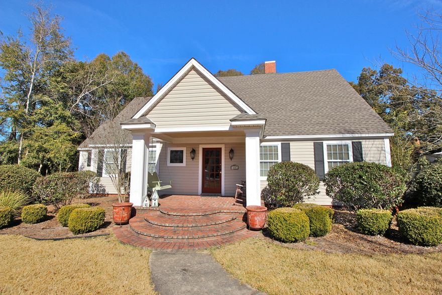 Classy. Sophisticated. Polished. Words which perfectly describe this stylishly updated home just 1 block from Lake DeFuniak. It has such an easy, comfortable flow with the dining/living/den that could be used interchangeably as your family desires. The lovely kitchen & den leads out to your peaceful 30x12 screened porch - room to dine, entertain and relax! Gleaming original heart pine & oak floors throughout with 2 spacious bedrooms & 2 full baths downstairs. Upstairs the master suite completely captivates you, with original brick column, separating out the sitting area & master bath. The 4th bedroom/office + 4th full bath completes the picture. It seems there are closets and storage around every corner! Including an entire 30x10 storage room off the 3 car carport. This one's a keeper!