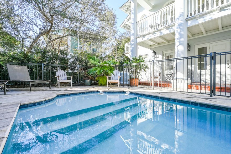 Tucked away on a quiet dead end street, south of 30A, this Rosemary Beach home boasts one of the largest private pools on the south side of Rosemary. Large porches and generous outdoor patio spaces embody the original vision of outdoor living in Rosemary. Quality craftsmanship abounds from detailed molding throughout, a beautiful sweeping staircase, and concrete block construction. The stately main house sleeps 10, with two master suites.  A highly functional carriage house, with full staircase, sleeps 4 and sits atop a 2 car garage. This lovely home is just steps to the tennis courts, playground, Coquina Pool, and beach walkovers A & B. Walkover A is one of only 2 handicapped accessible beach access points in Rosemary.  Very strong rental history.